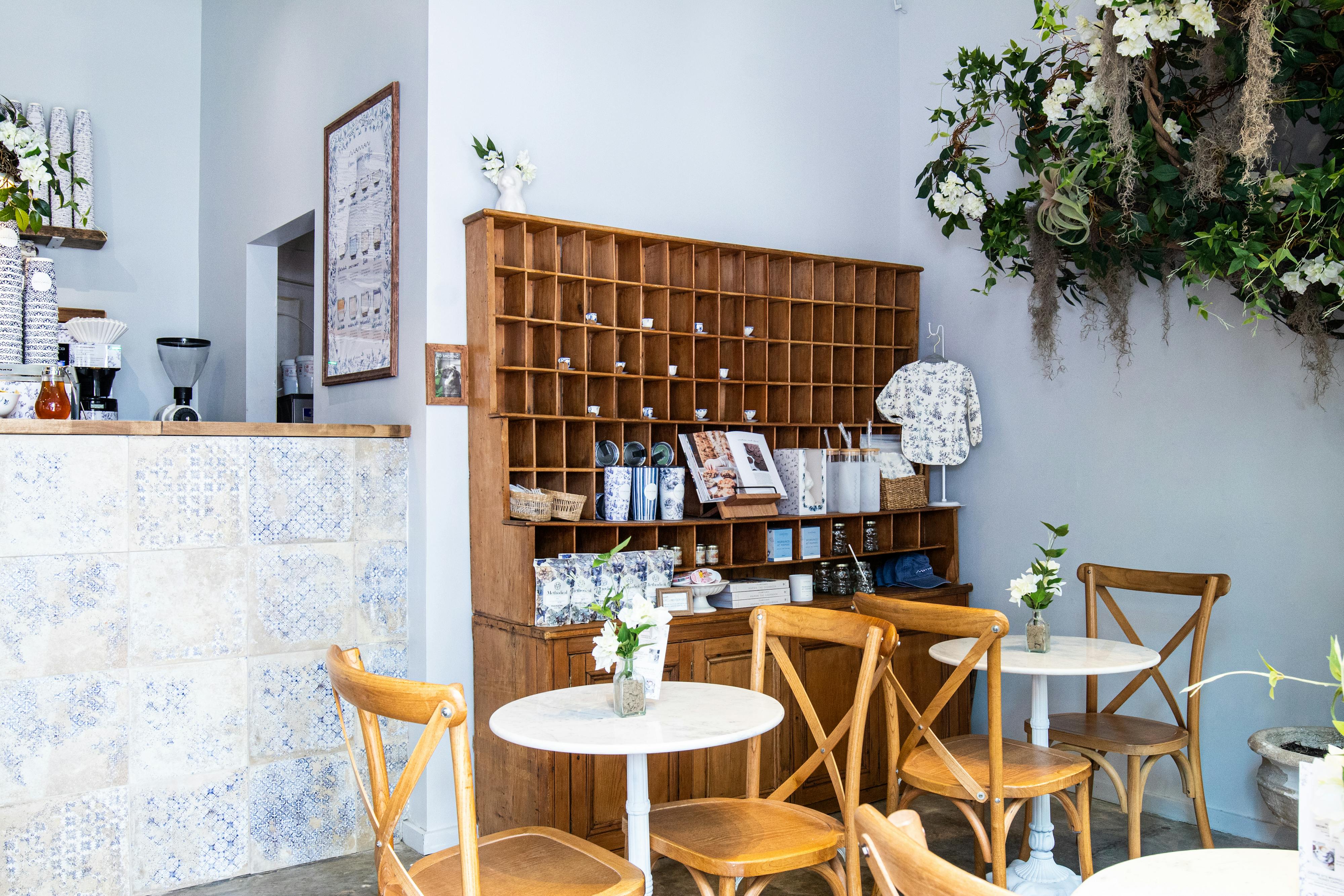 cafe tables, chairs and retail shelf