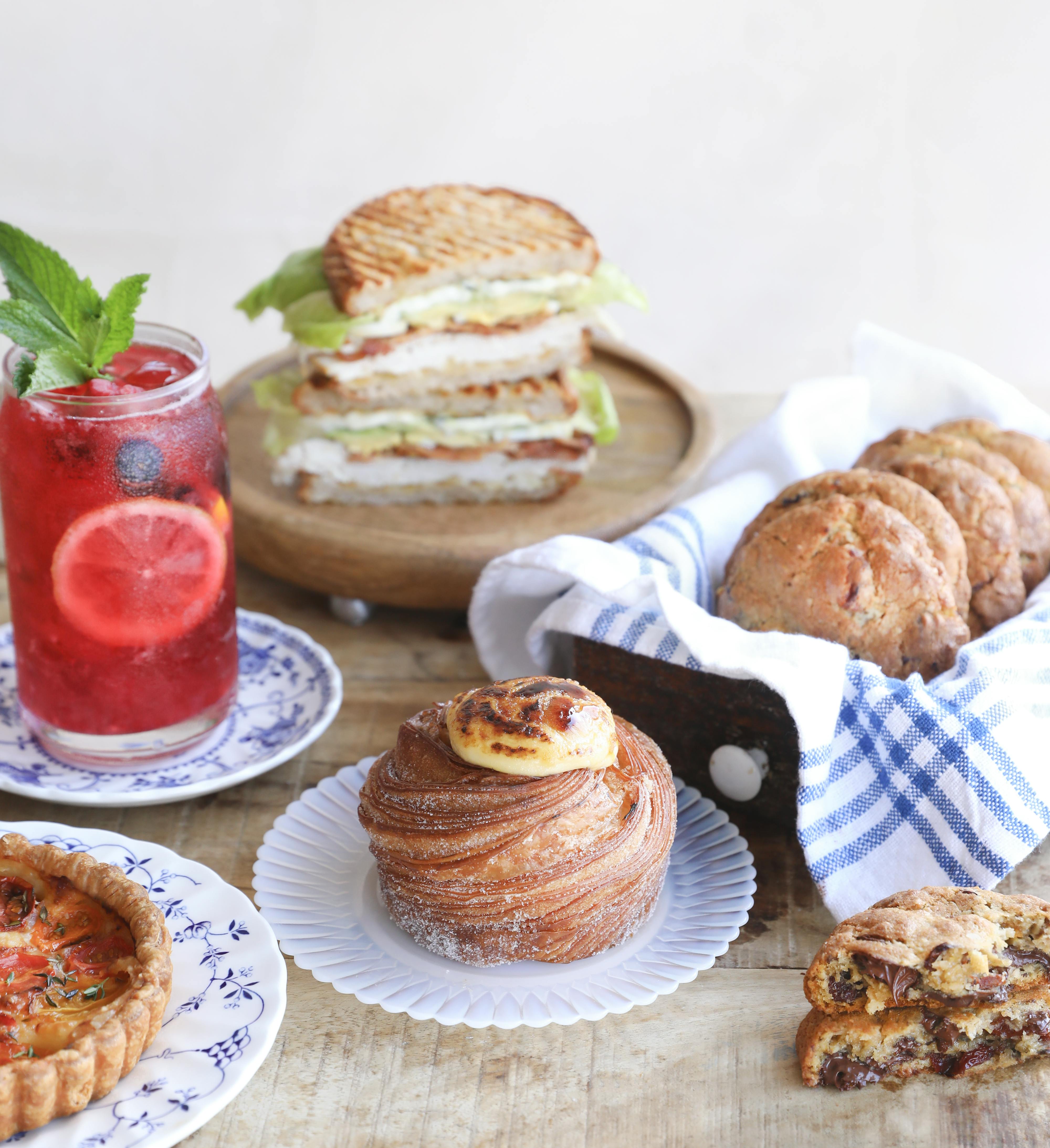 table spread with sandwich, cookies and ice tea