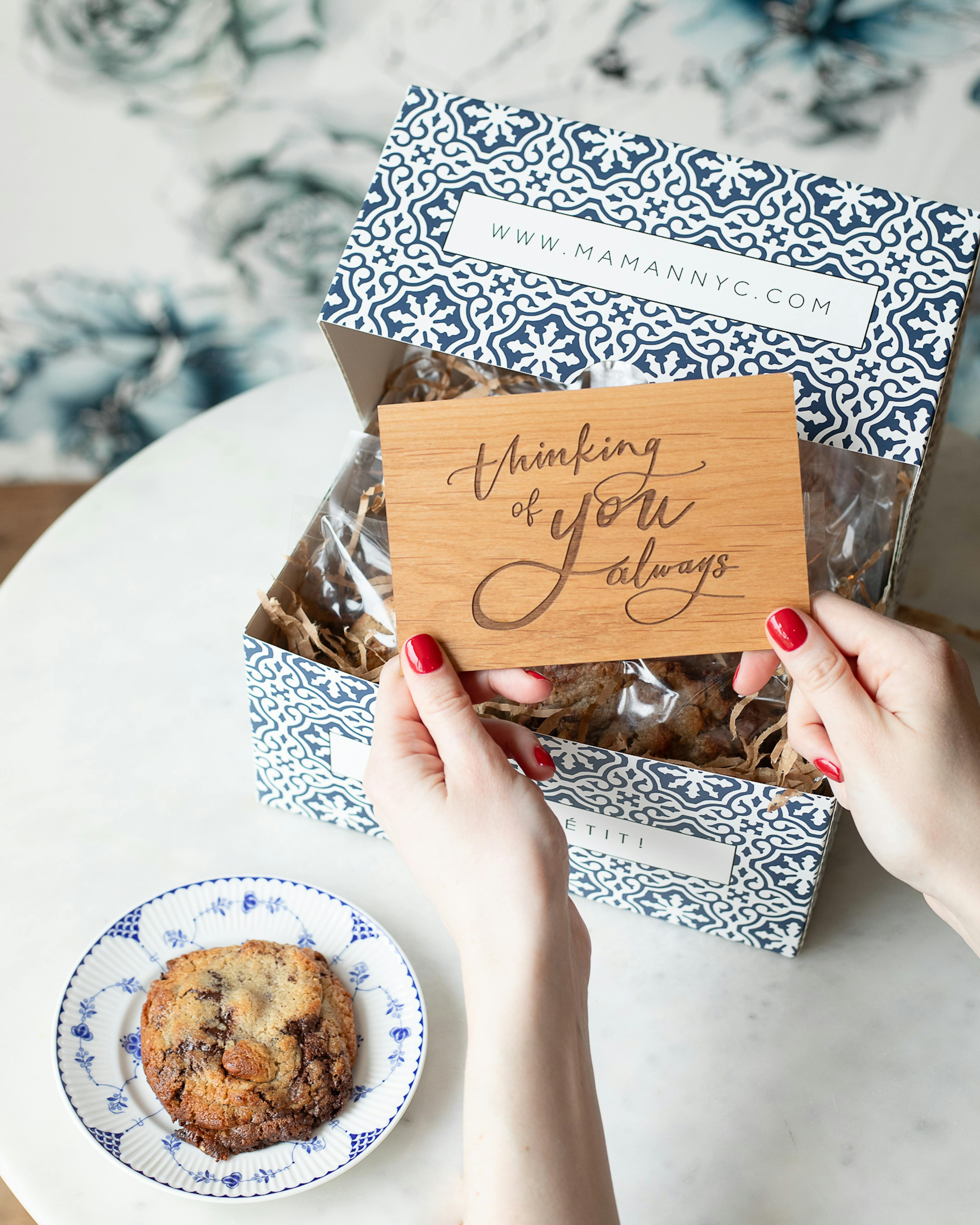 wooden card with text and cookie box retail