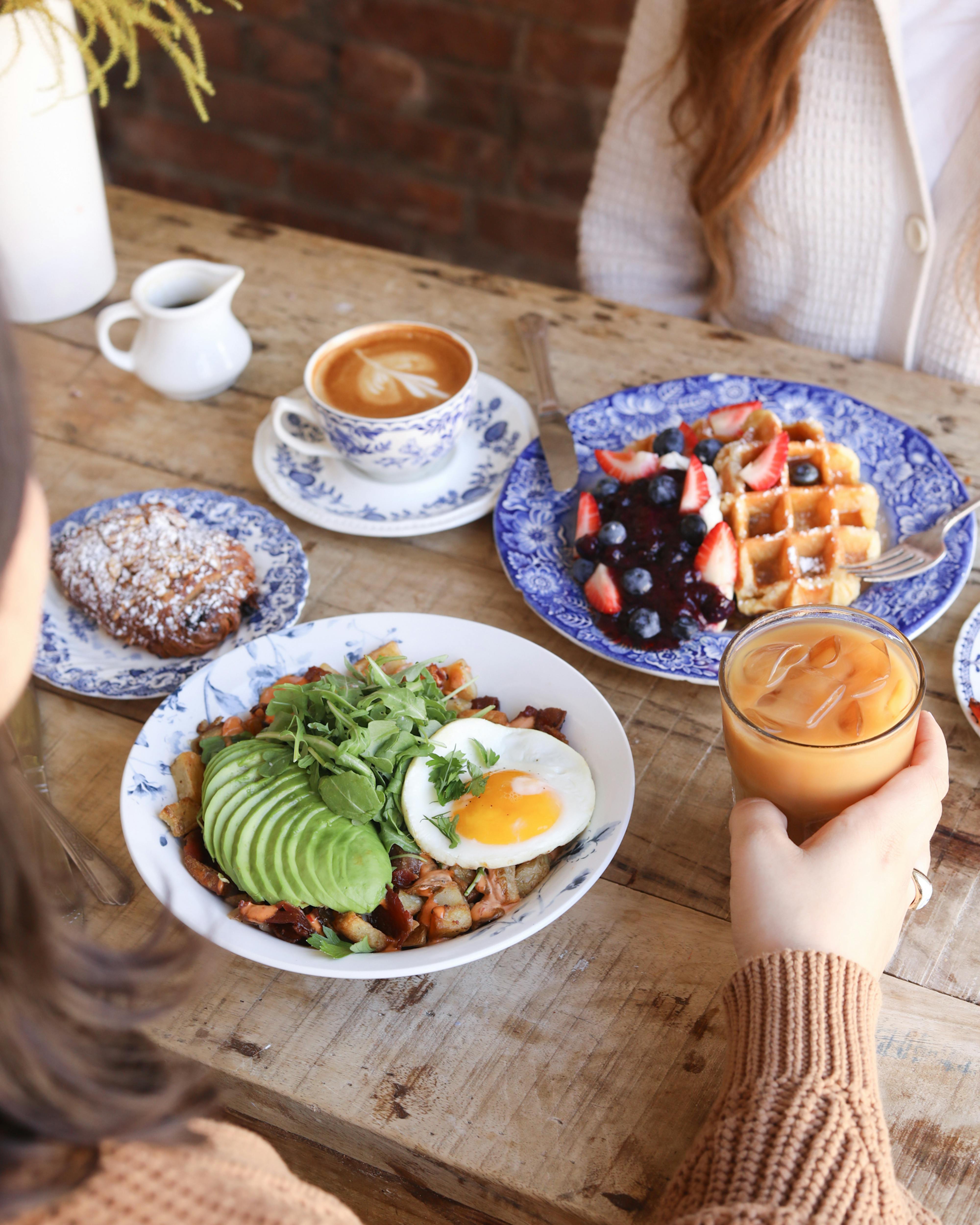 breakfast bowl and waffles at table