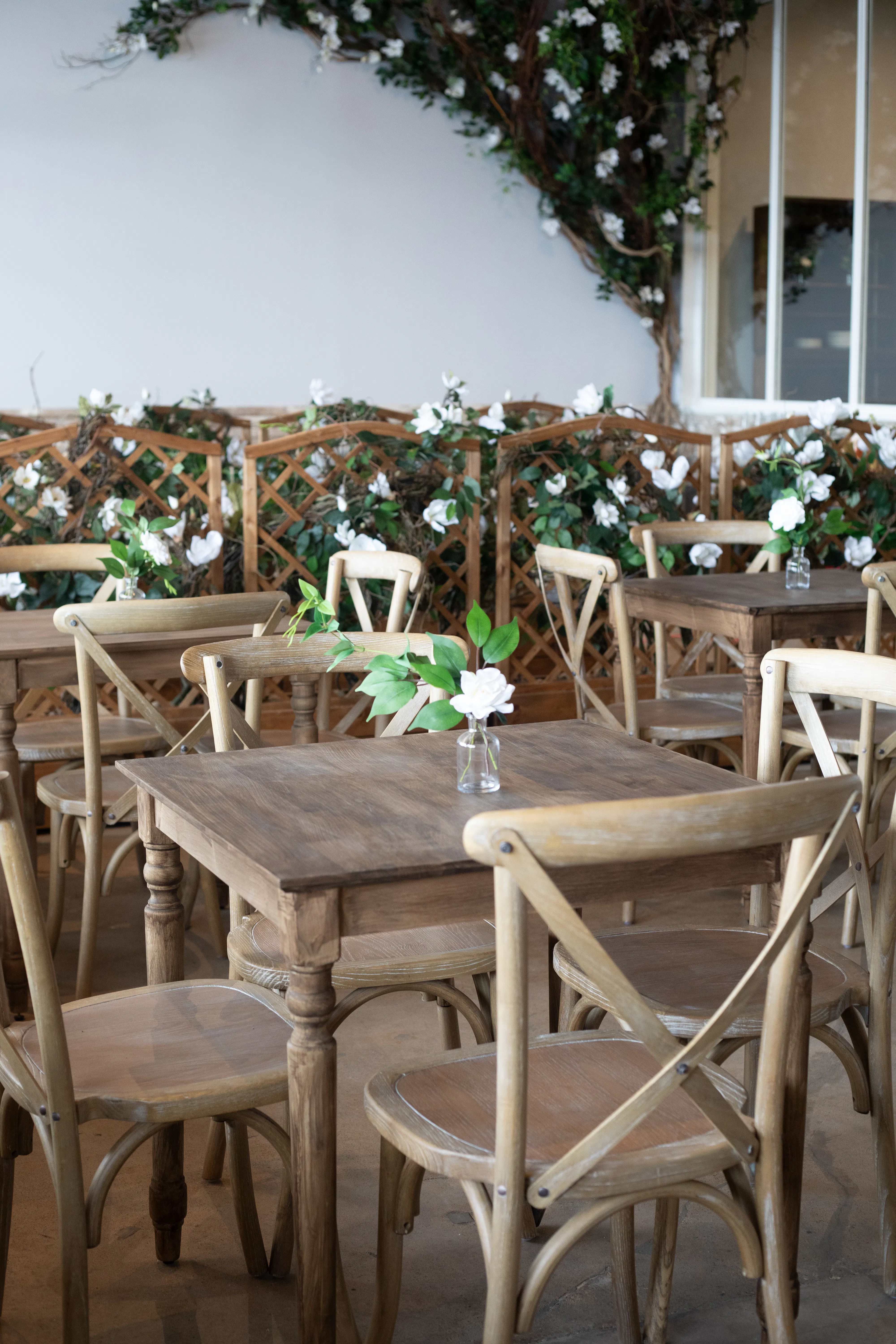tables and chairs in cafe dining room with florals