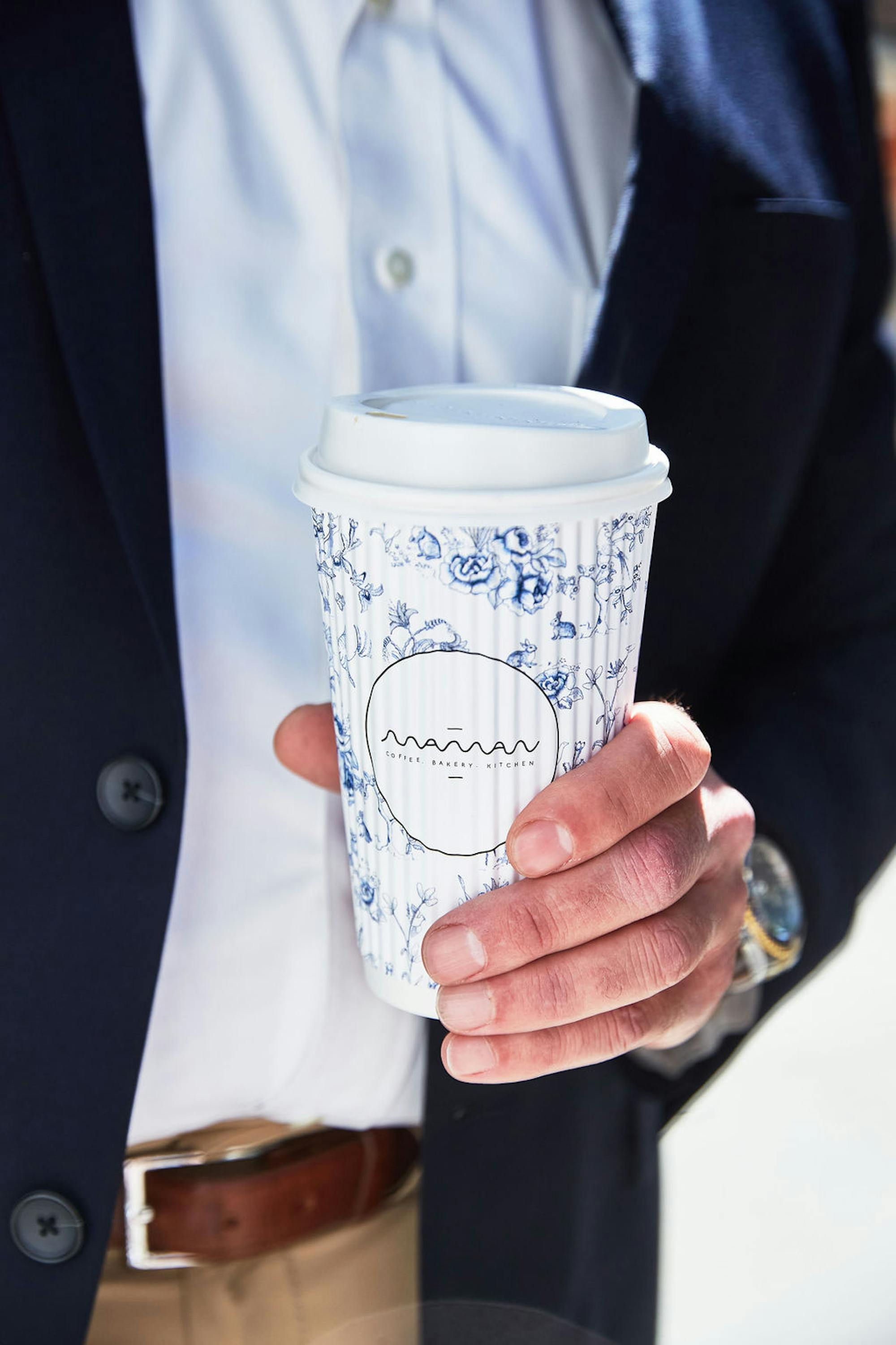 man holding maman cup