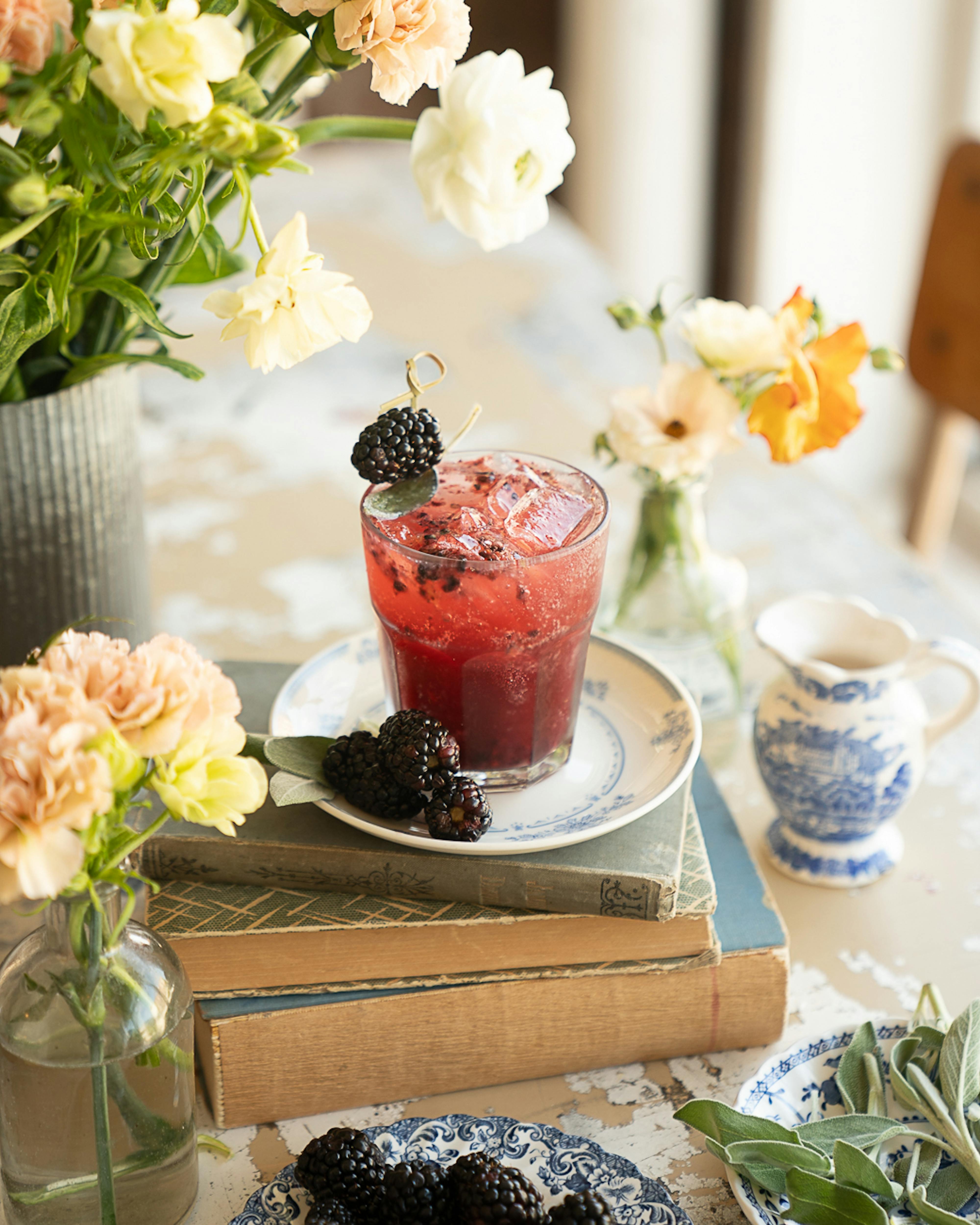 blackberry sage smash cocktail on table