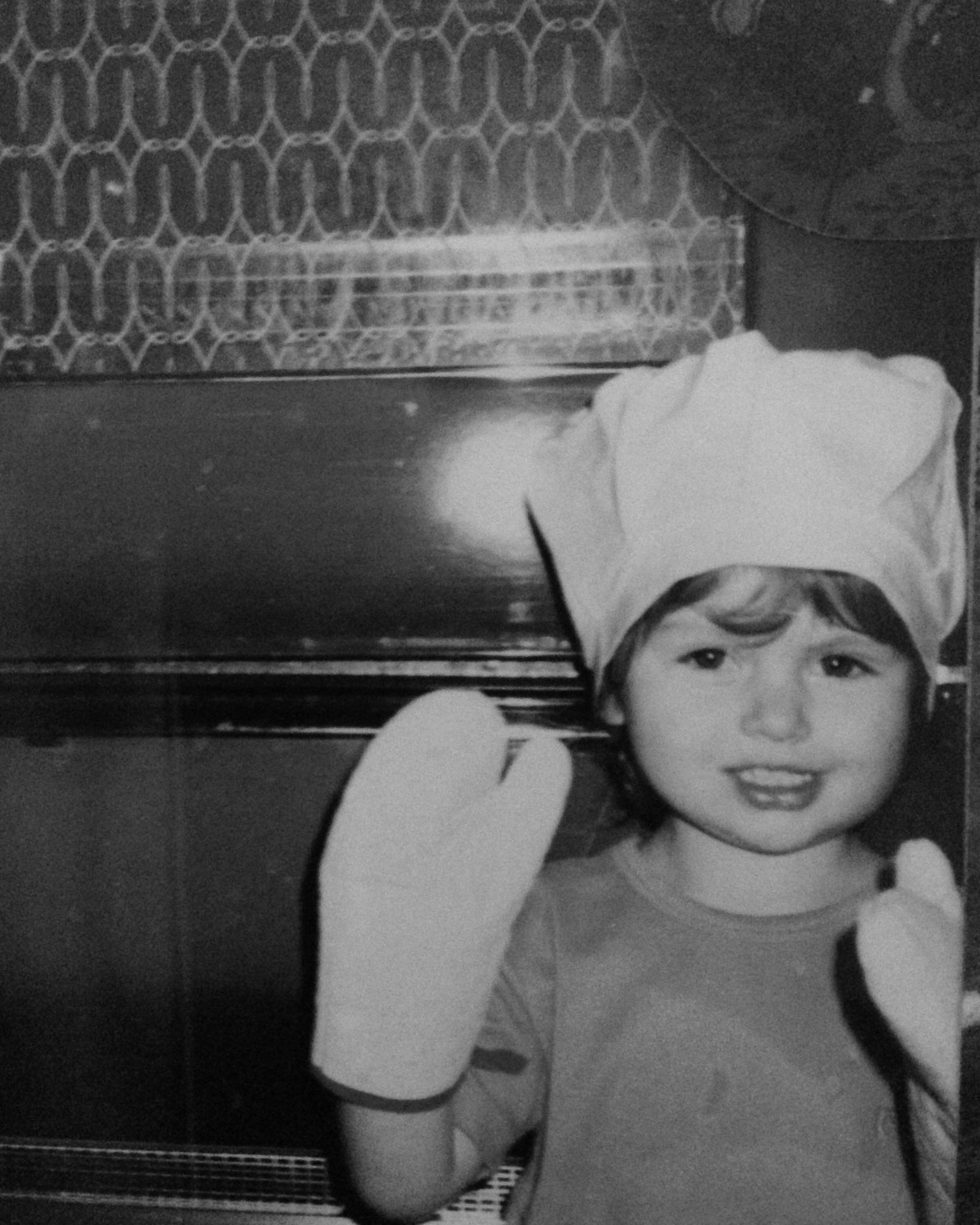 maman co-founder Elisa as a child with oven mitts on