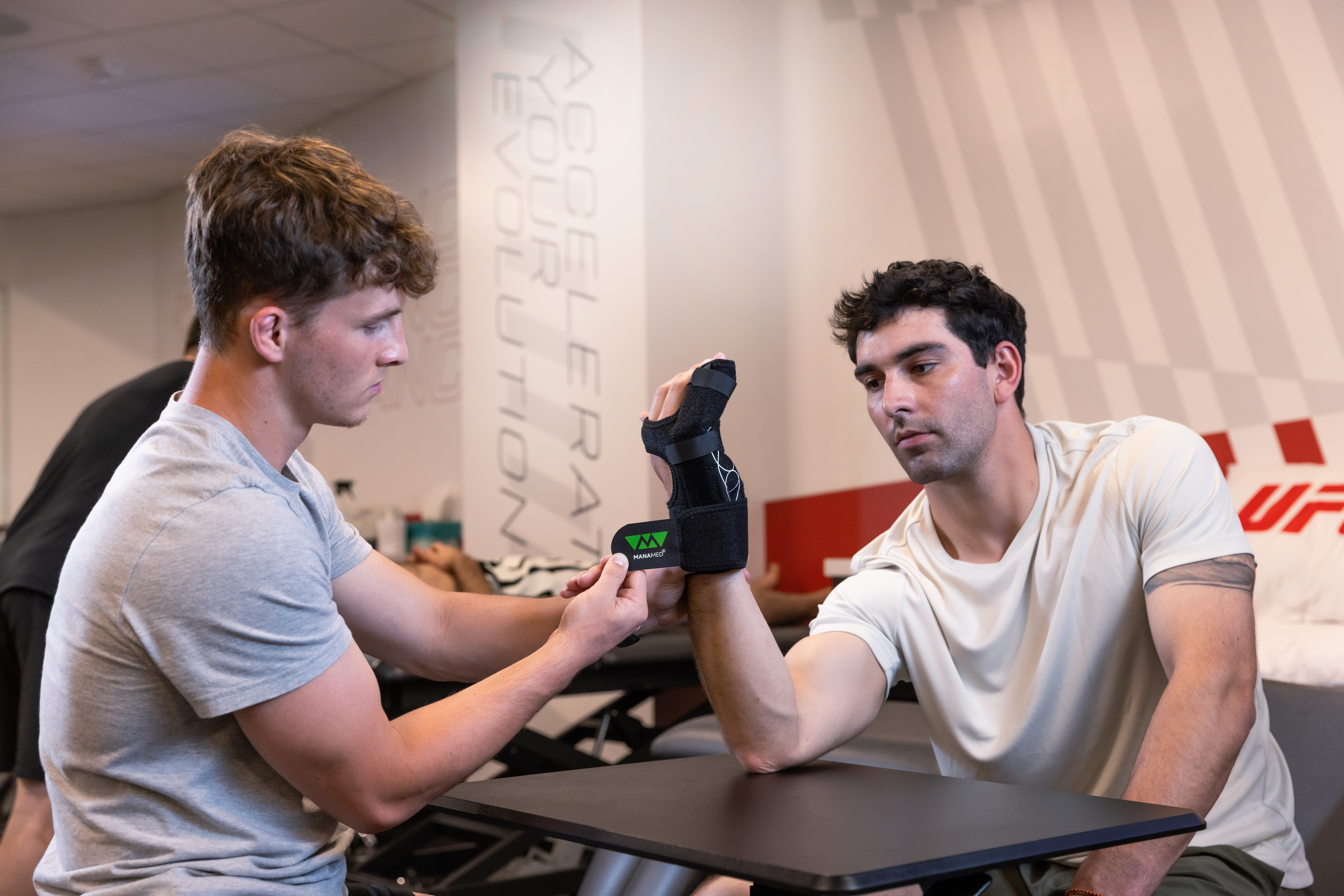 The ManoFX brace on an athlete at at trainers table.
