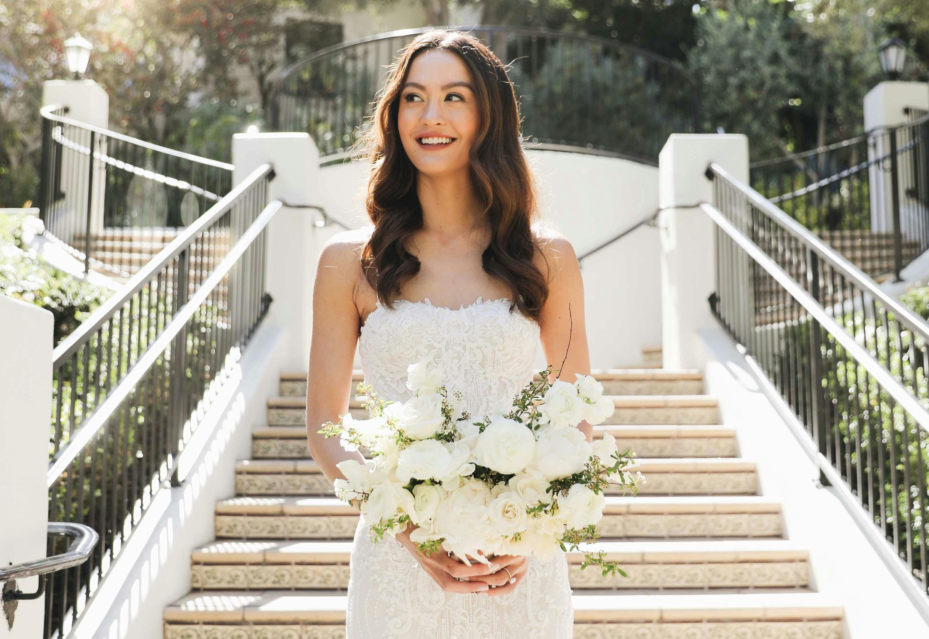 beautiful bride holding a flower bouquet