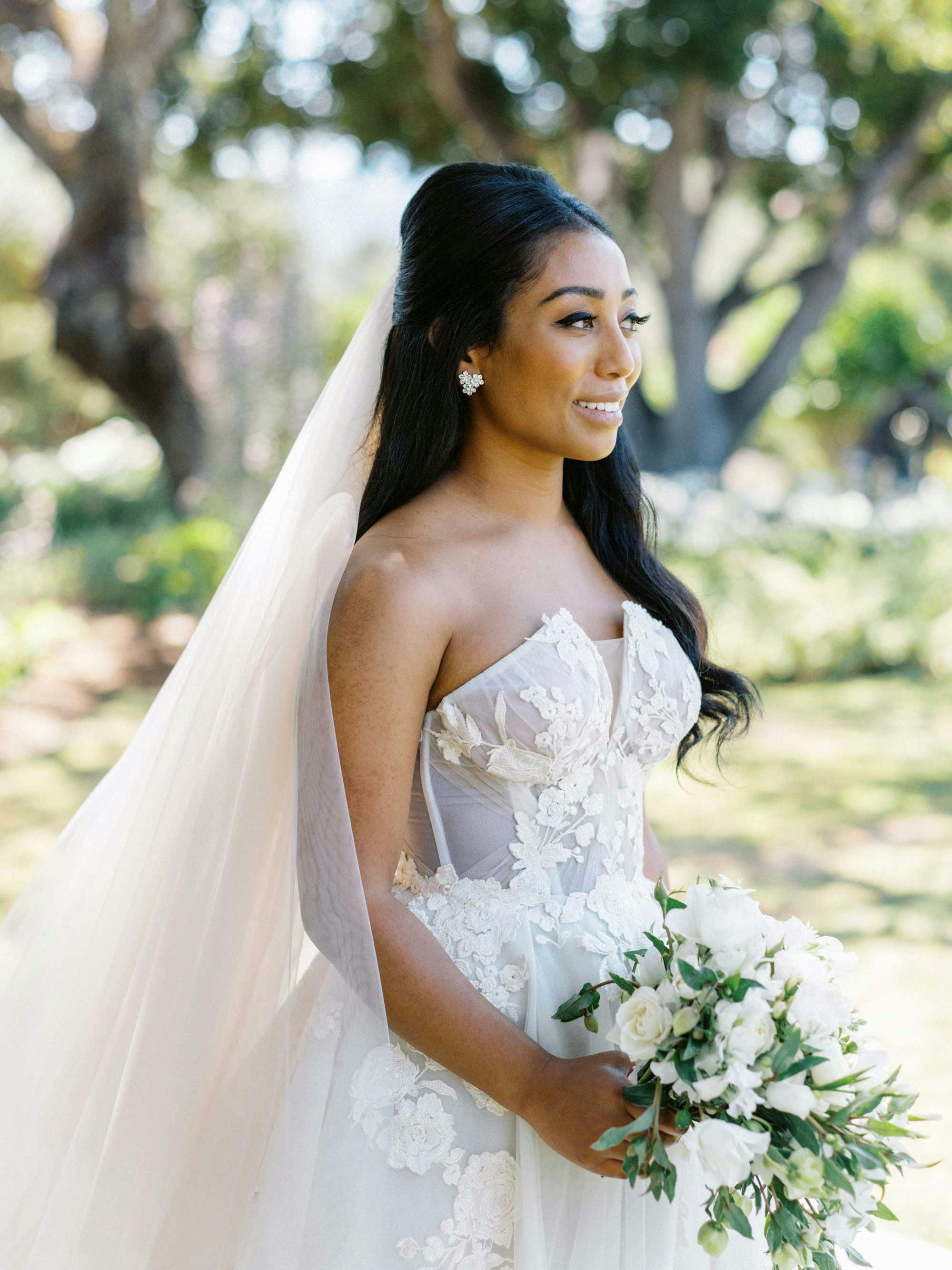 beautiful bride holding a flower bouquet