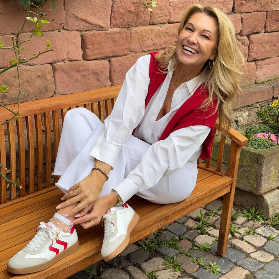 Sneakers with red stripes