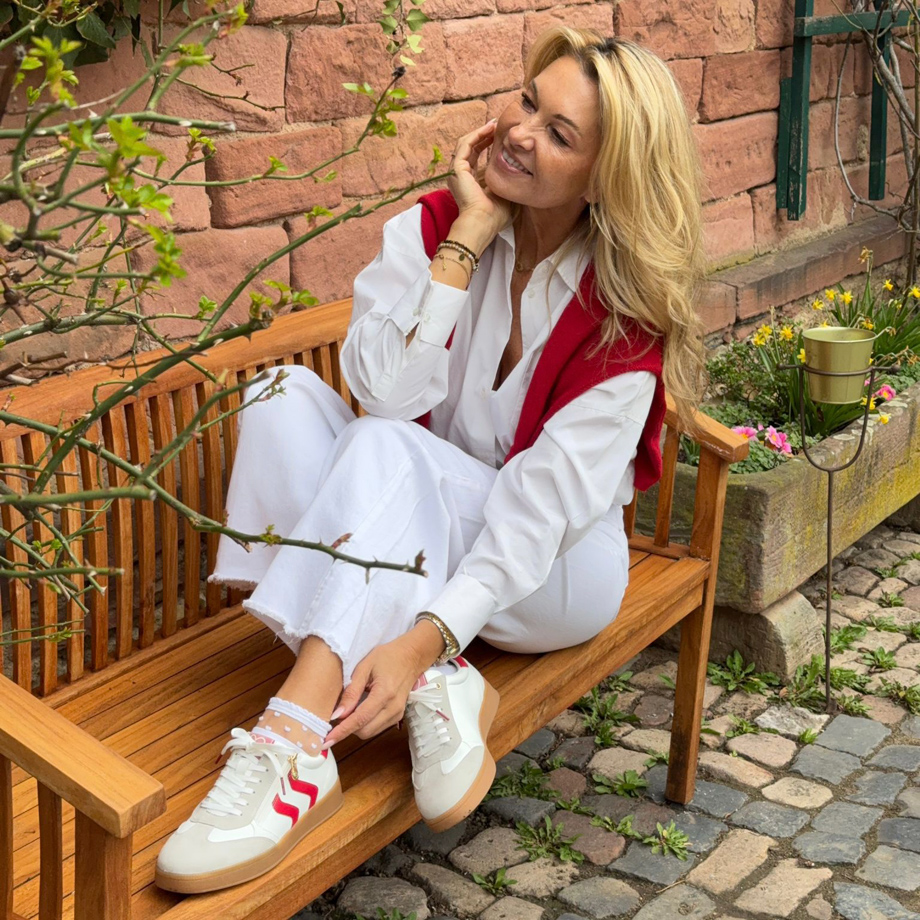 Sneakers with red stripes