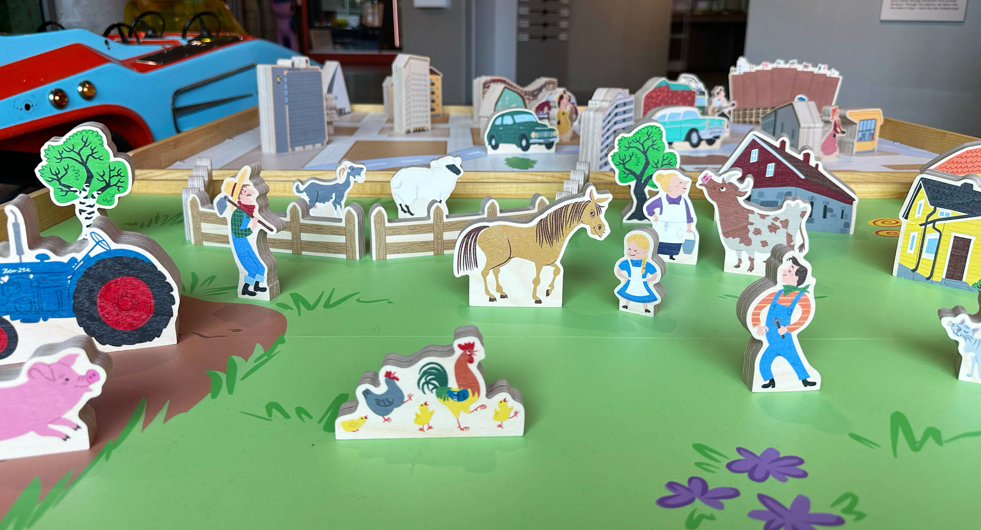 1950's themed play station with wooden farm and city themed toys