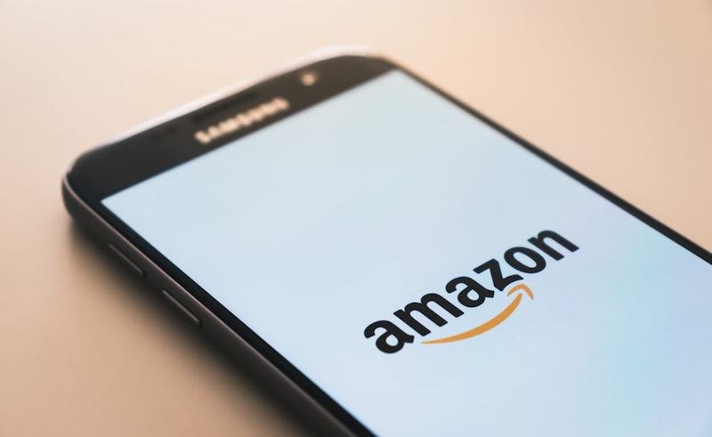 Amazon logo displayed on the smartphone screen. 