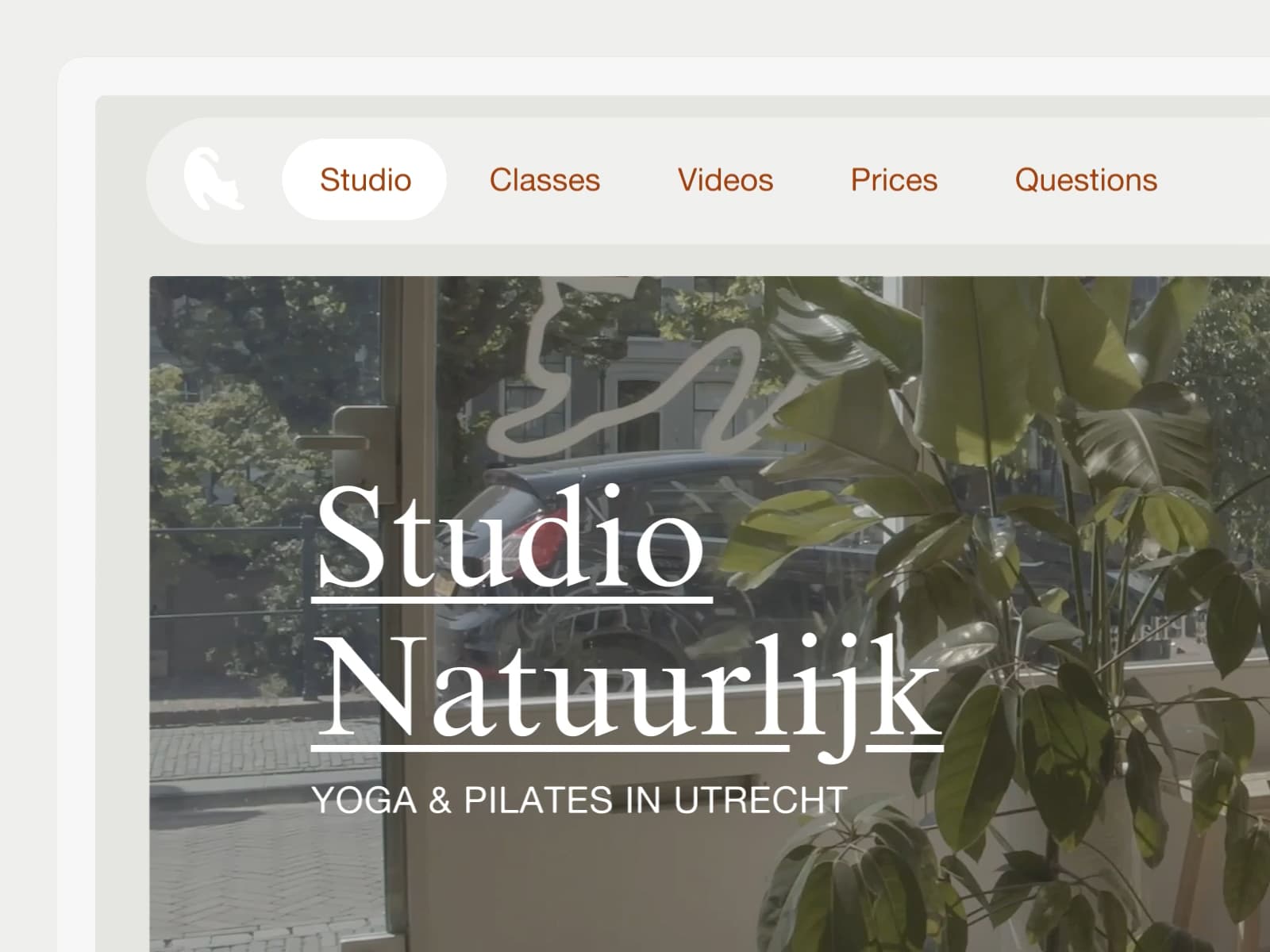A crop of the website showing the main navigation, the logo and a photo of the street on which the yoga studio is located.