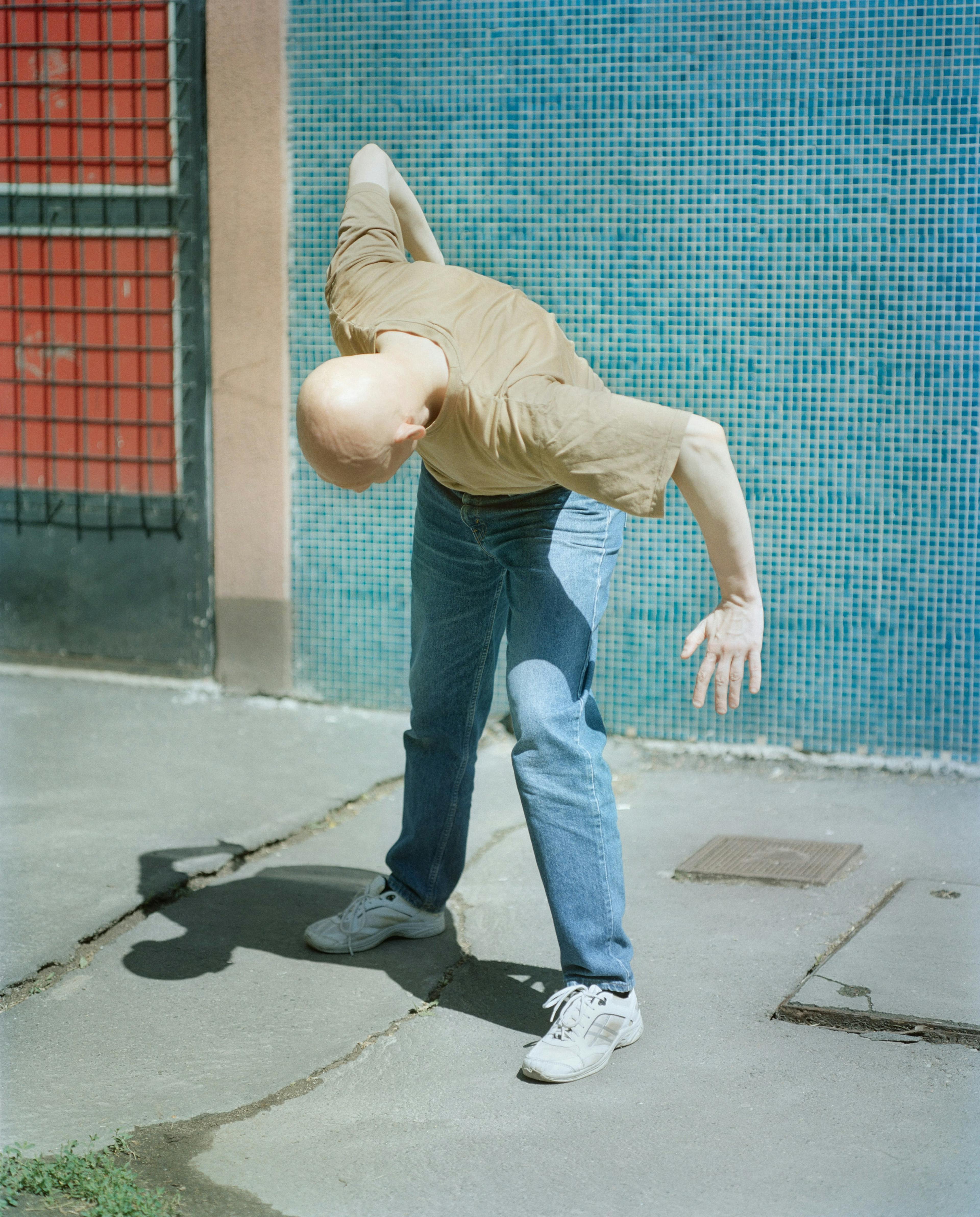 bald man bending over