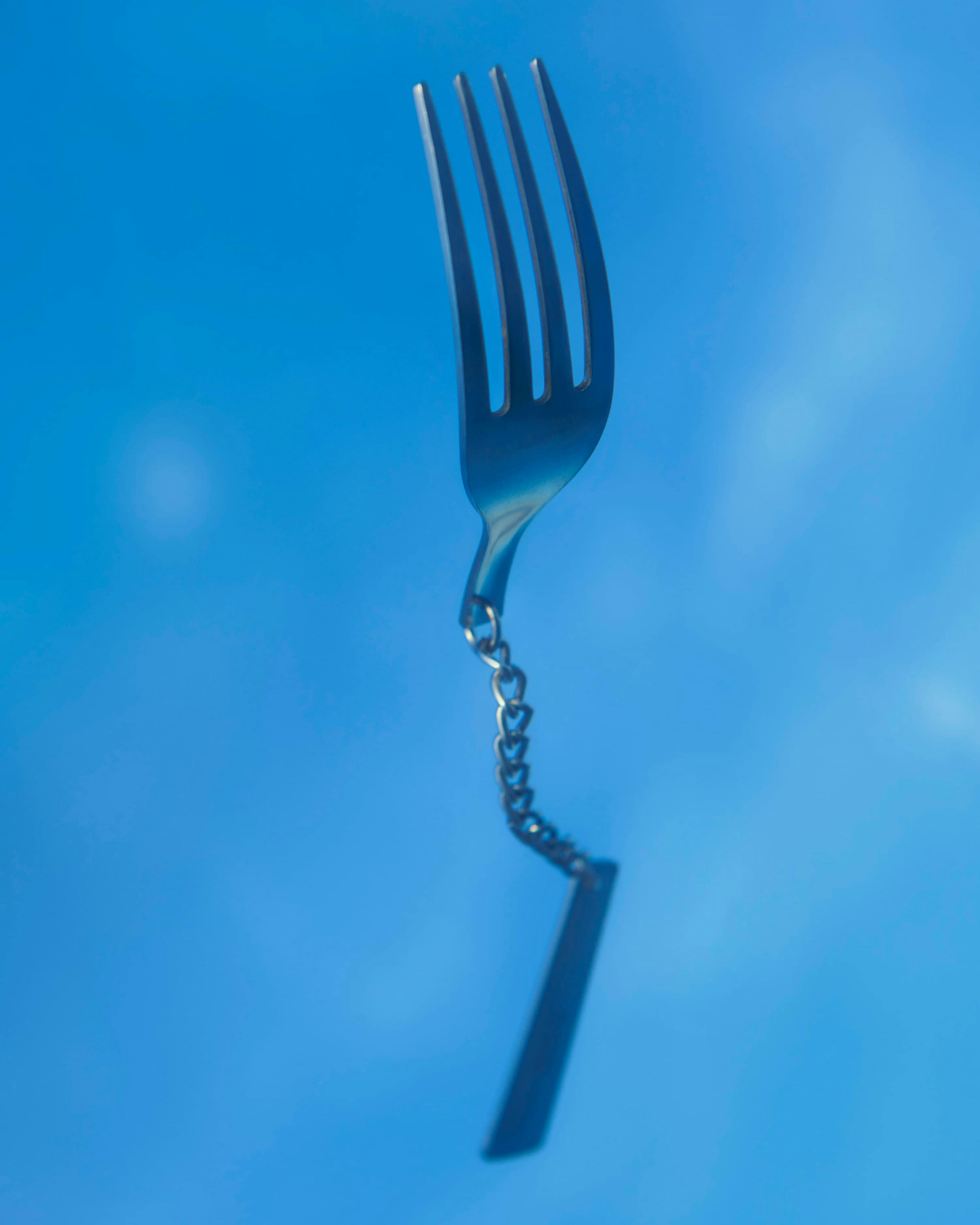 a flying fork with a chain handle