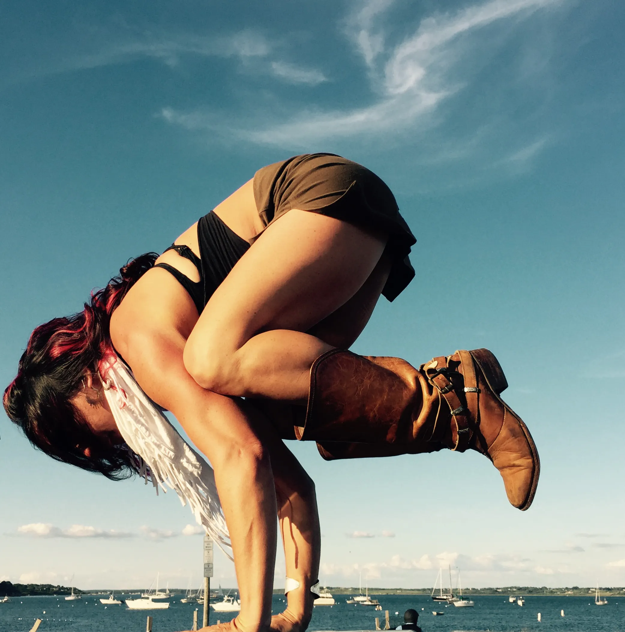 Mary teaching an advanced yoga pose.