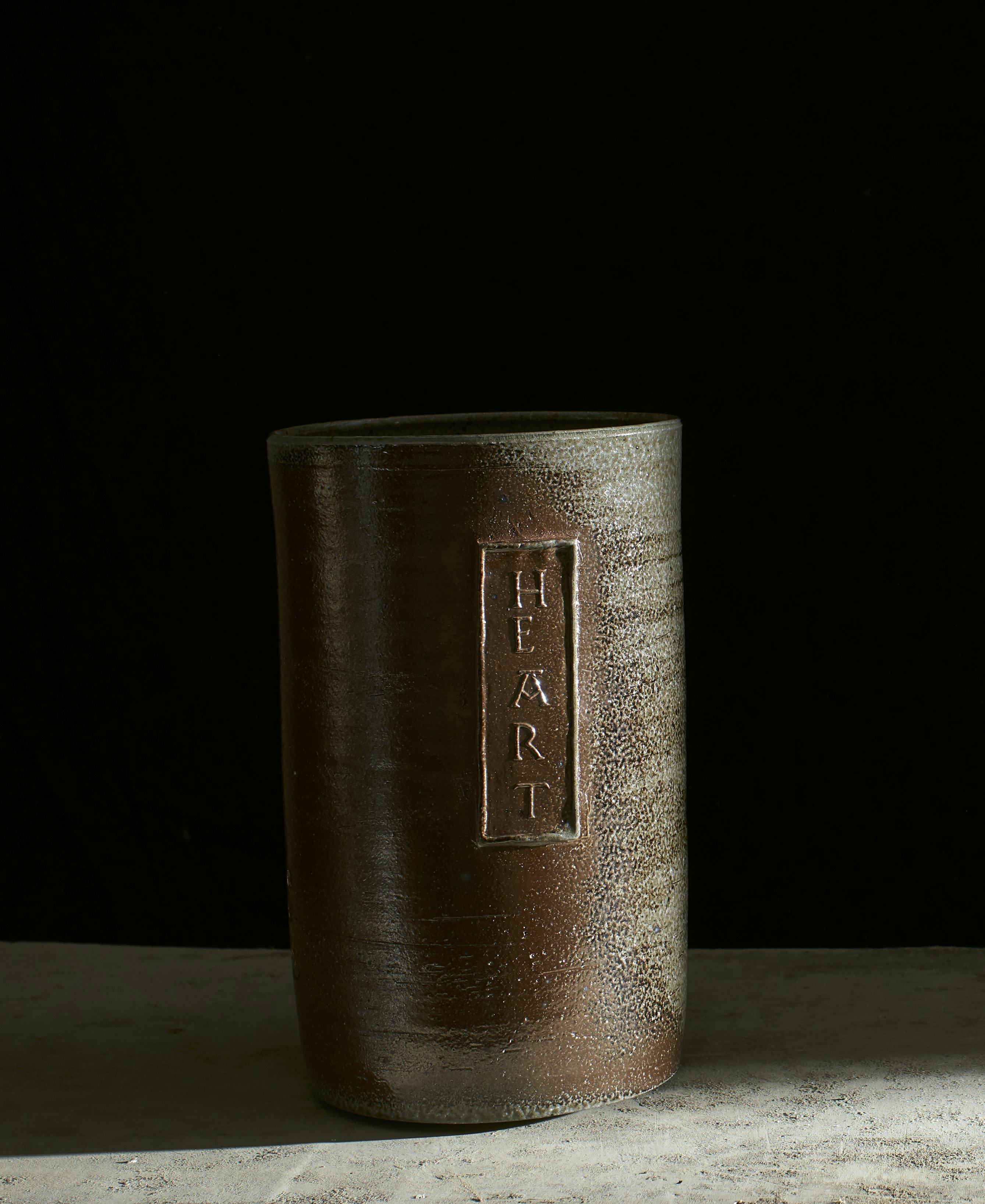 Salt glazed ceramic pot with text