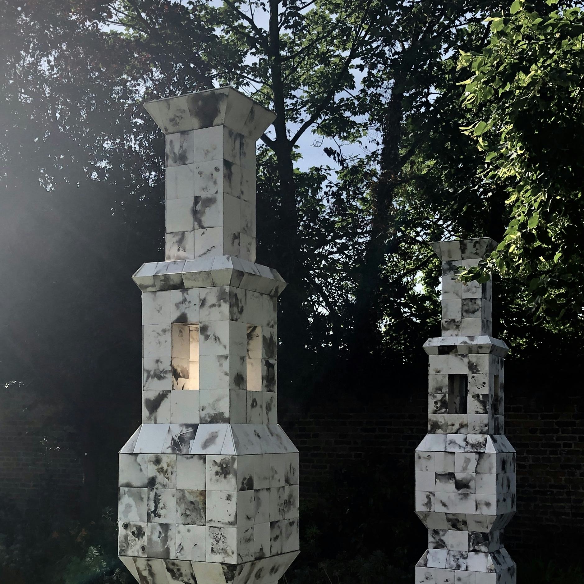 A detail of two ceramic tiled lanterns