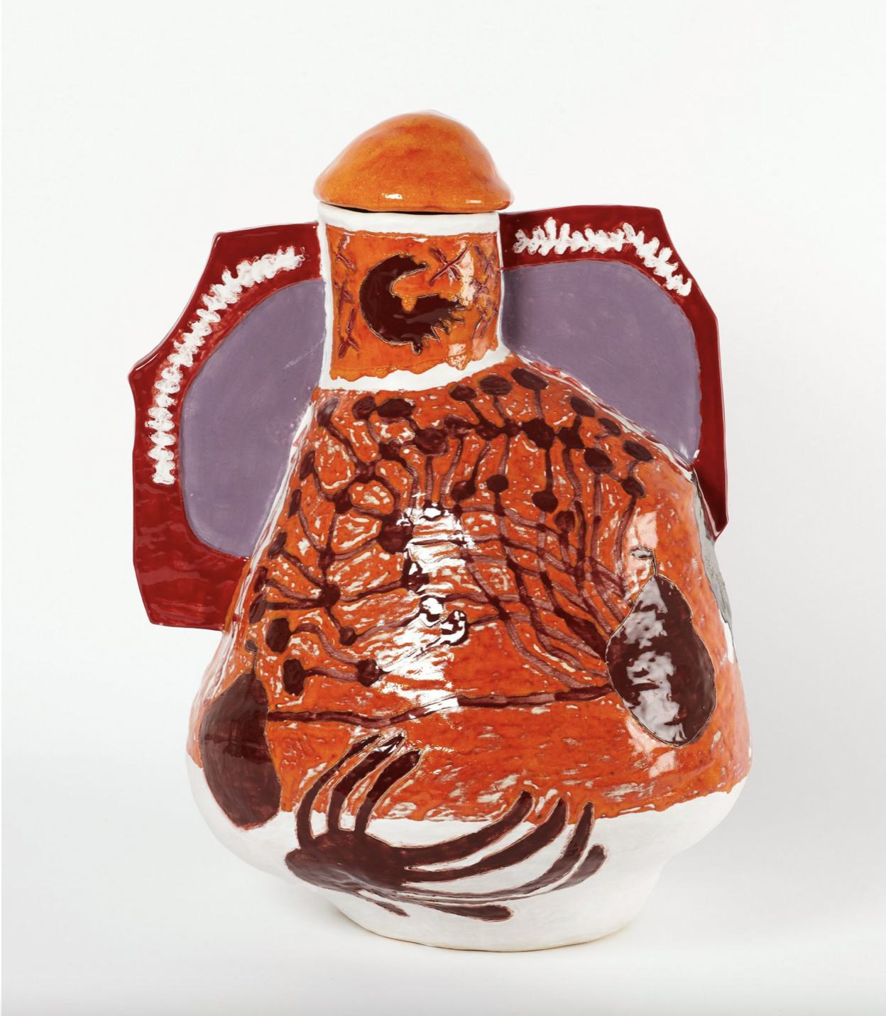 A handmade ceramic artwork with colourful glazed patterns