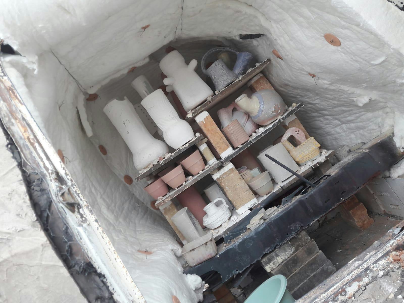 Ceramic vases stacked inside a kiln