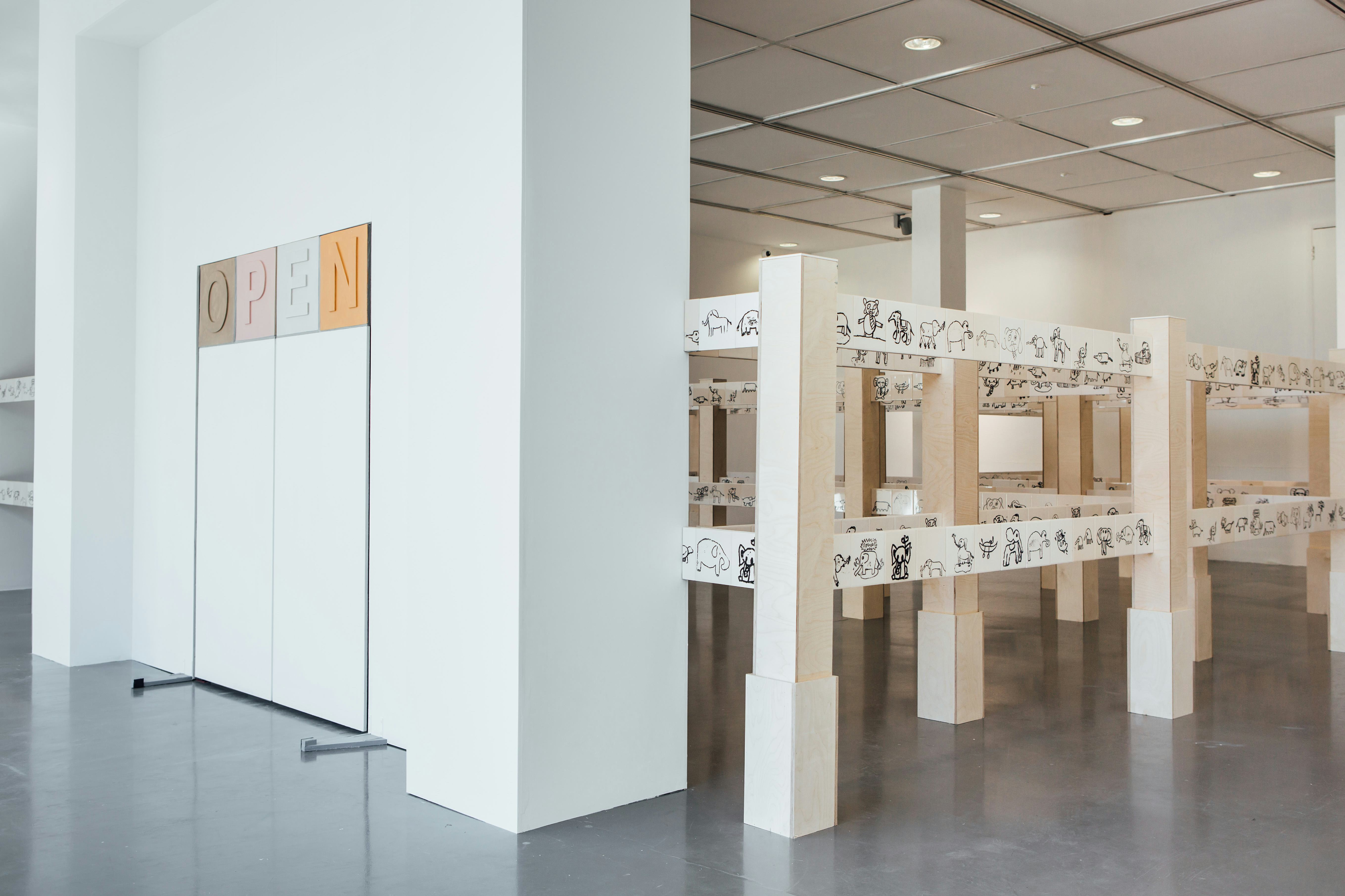 An art gallery with a large ceramic installation