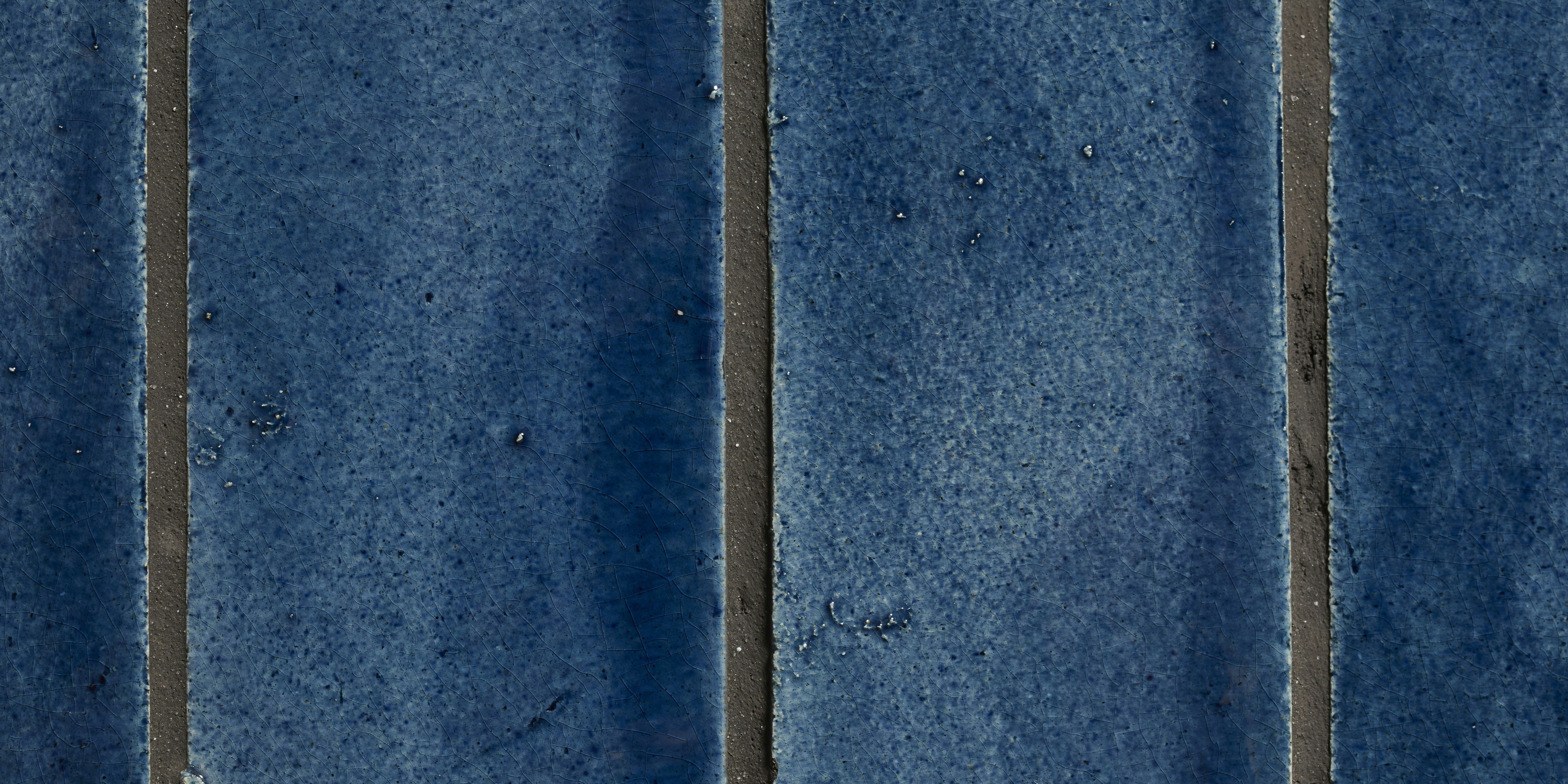 A detail of handmade blue tiles