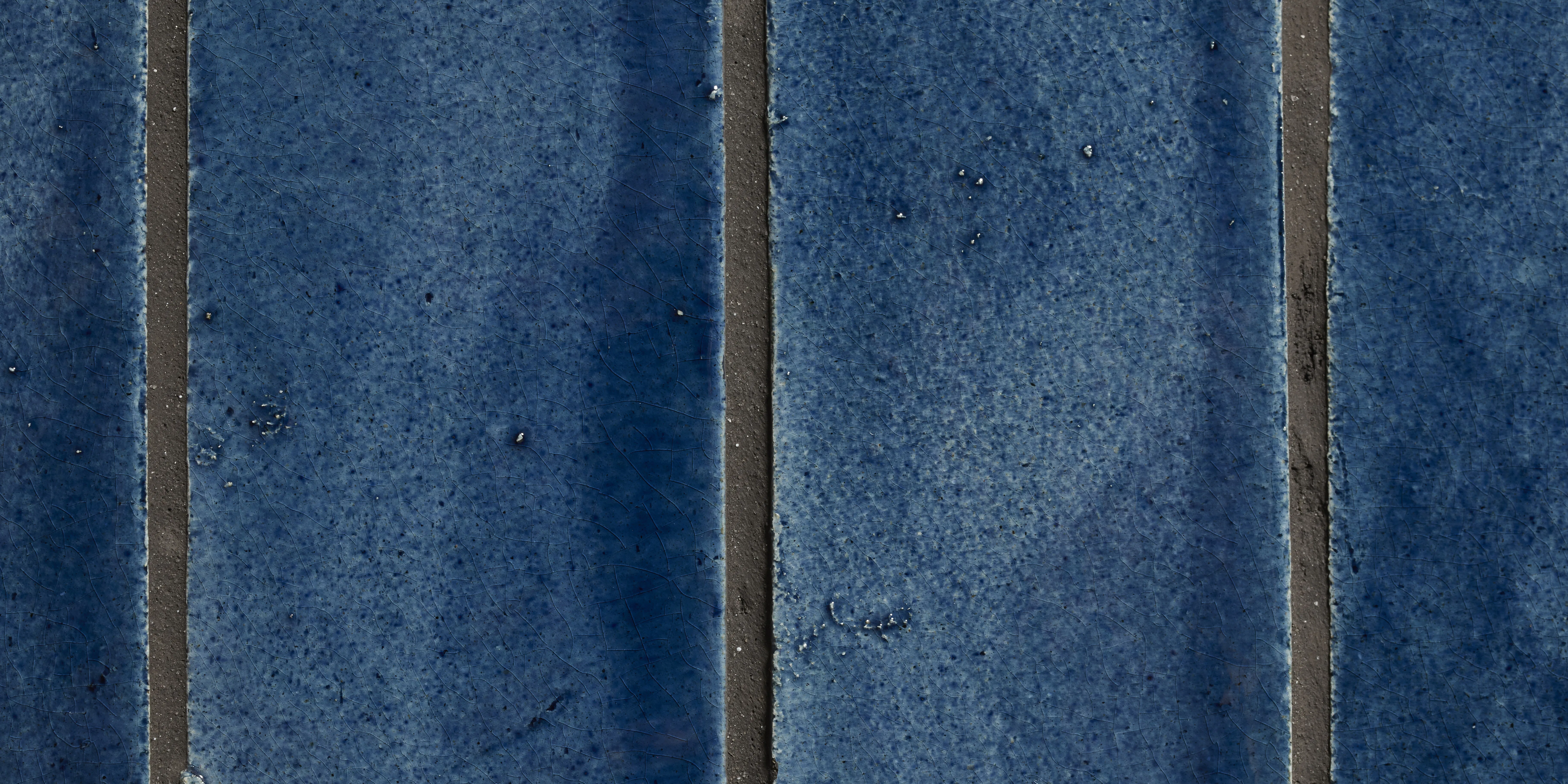 A detail of handmade blue tiles