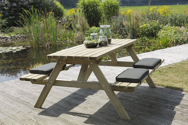 Wooden picnic table with cushions 