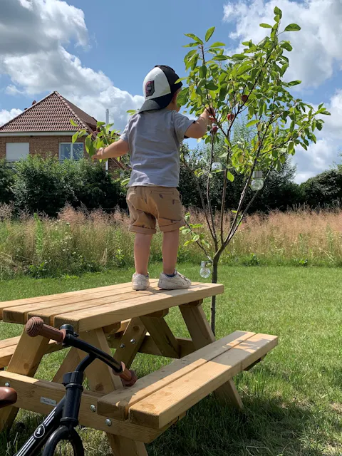 Tallinn children’s picnic table with a child on the table