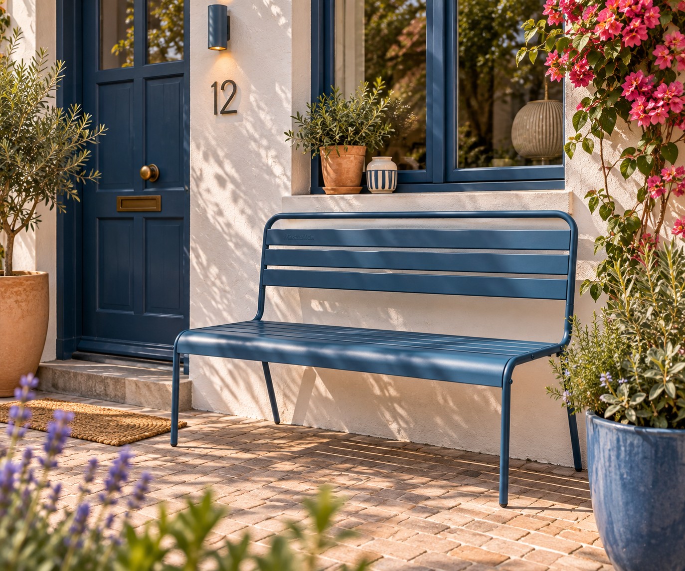 Petrol blue garden bench in front of the house