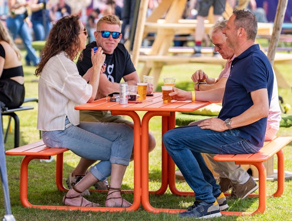 MaximaVida metal picnic table Max orange at festival