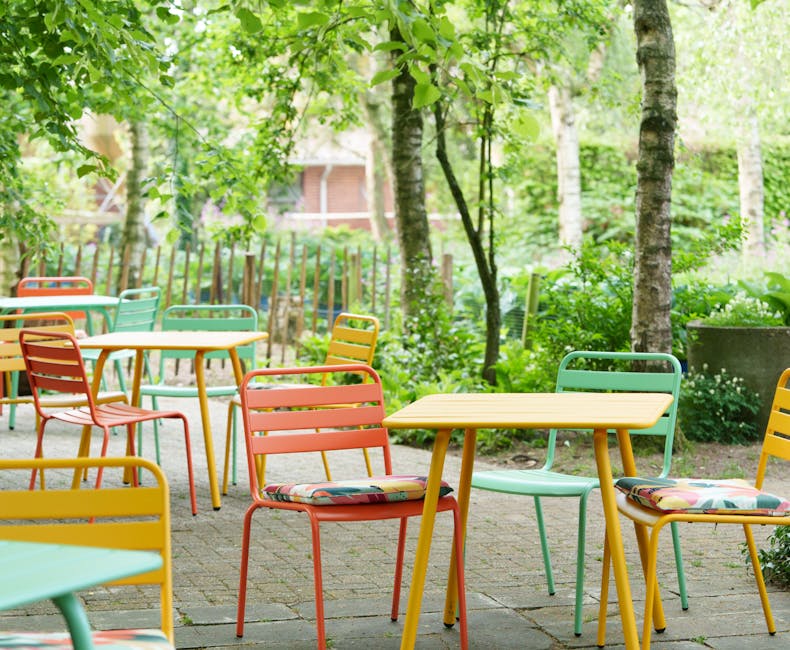 Coloured Max chairs with cushions on the terrace of the Rensink tea garden