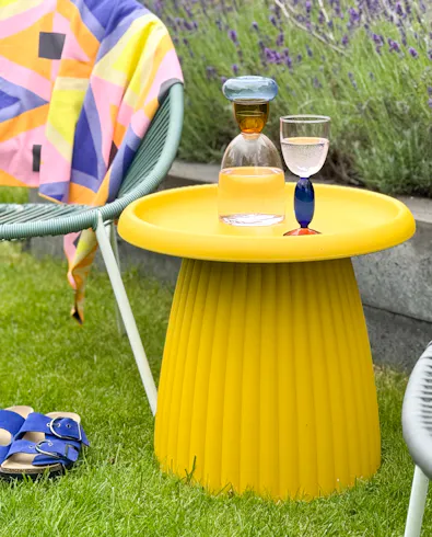 Mila ochre-yellow plastic side table for outdoor use in the garden