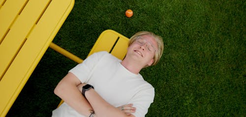Outside is a playing field with a colourful picnic table.