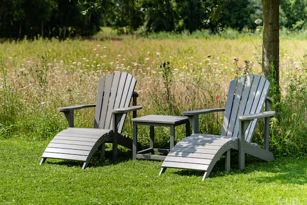 Grey Montreal Adirondack chair in the garden
