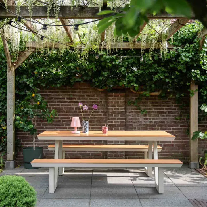 Ivory Bermuda picnic table in a garden