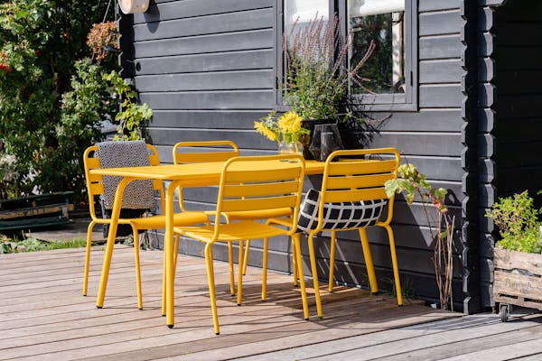 Ochre yellow Max garden furniture set at holiday home
