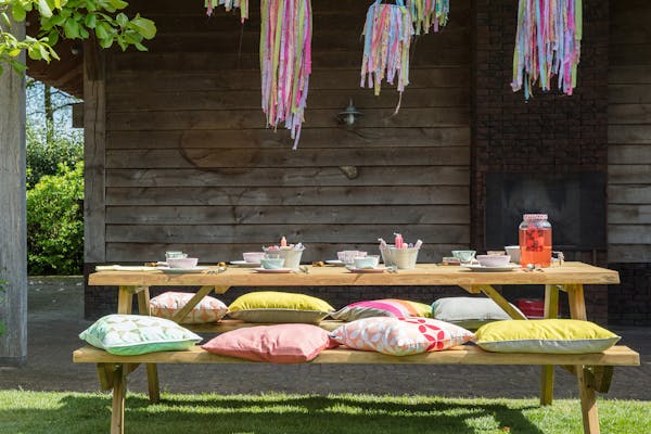 Decorative cushions on picnic table