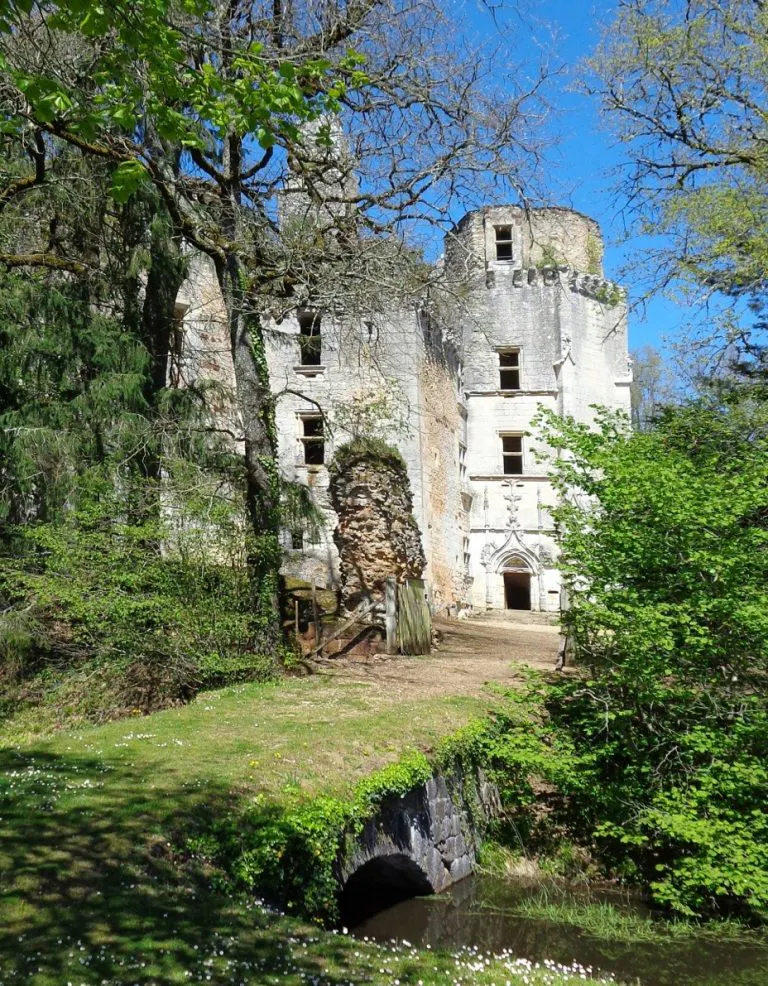 Chateau L'Herm set in the peaceful Dordogne countryside surrounded by its moat with access over a bridge