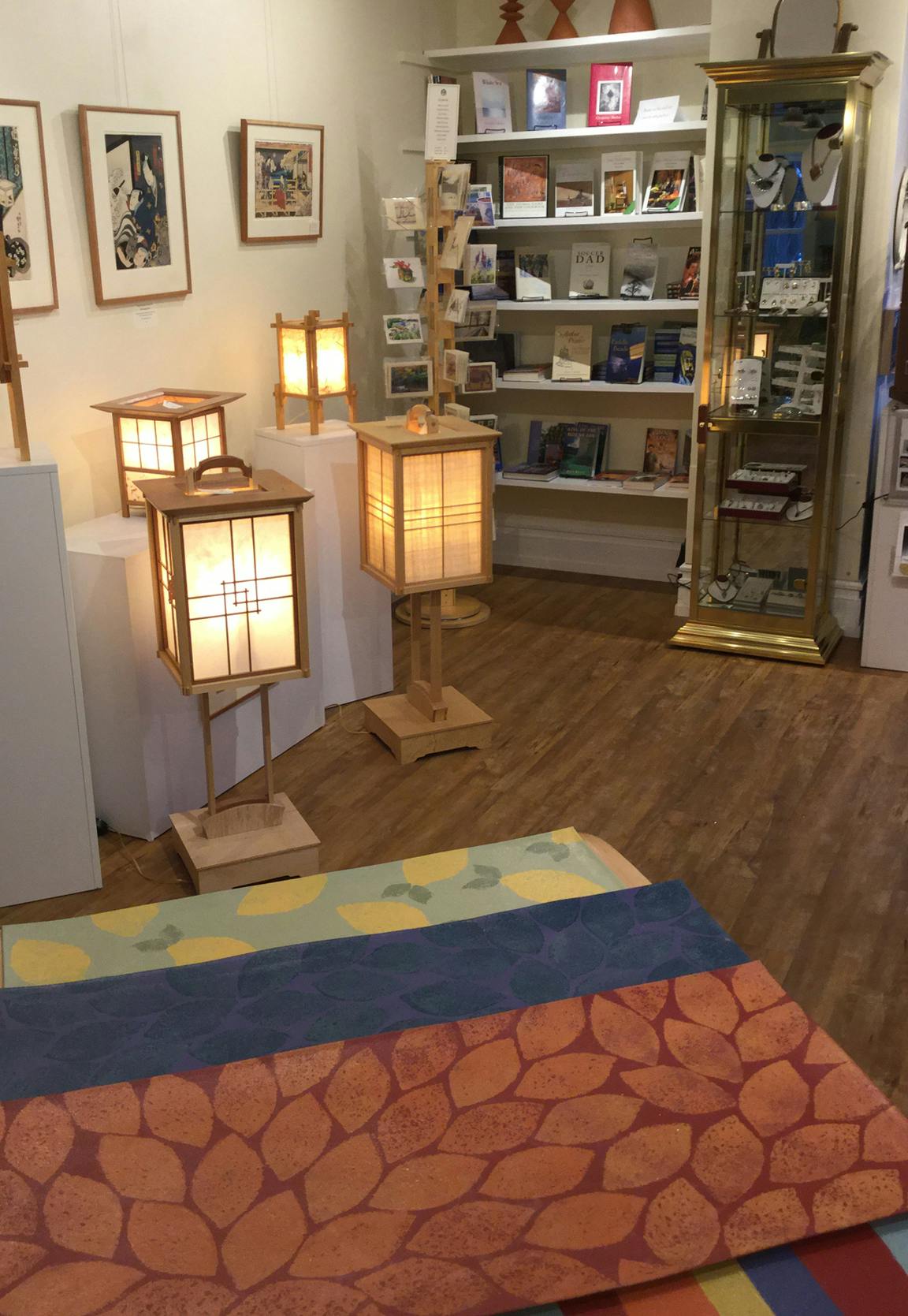 Books, lamps, pottery, floor cloths, jewelry, flat art . . .  we have a sweet variety of things to look at here.