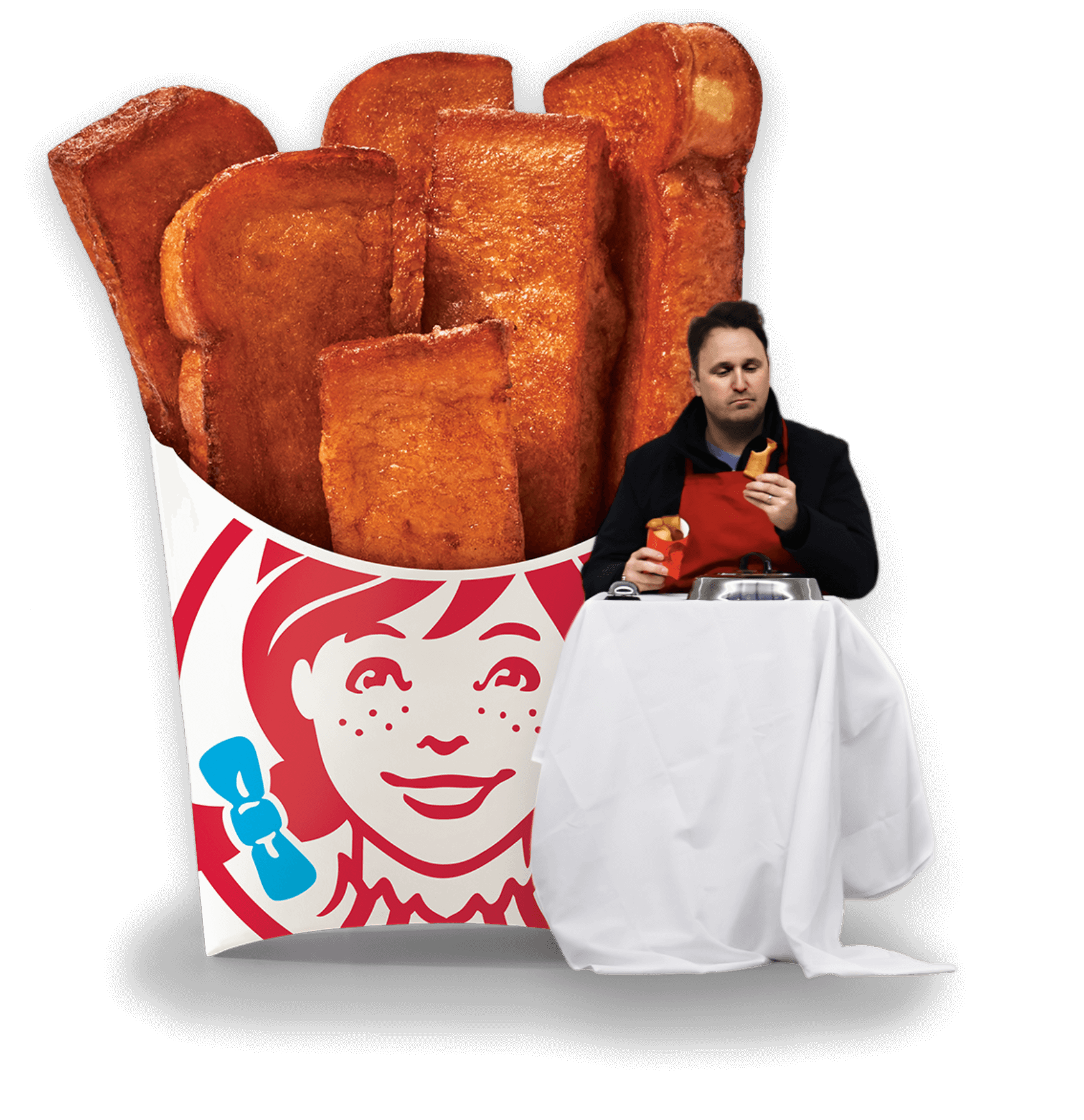 A man is seated at a table enjoying Wendy’s French toast sticks. In the background there is an enlarged view of the food.