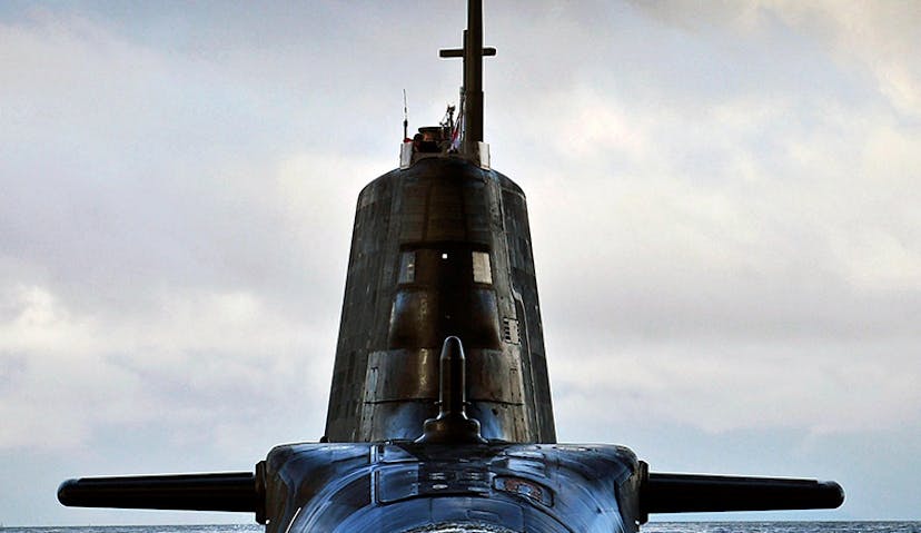 A submarine rising out of the sea.