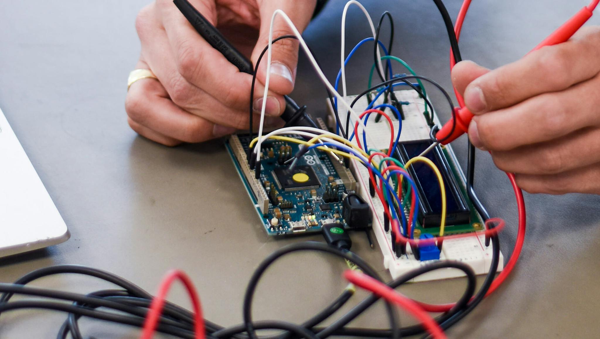 Someone using a circuit board.