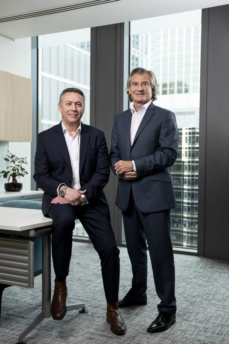 Heather with McLaren Chairman Kevin Taylor at the firm's office in Canary Wharf. 