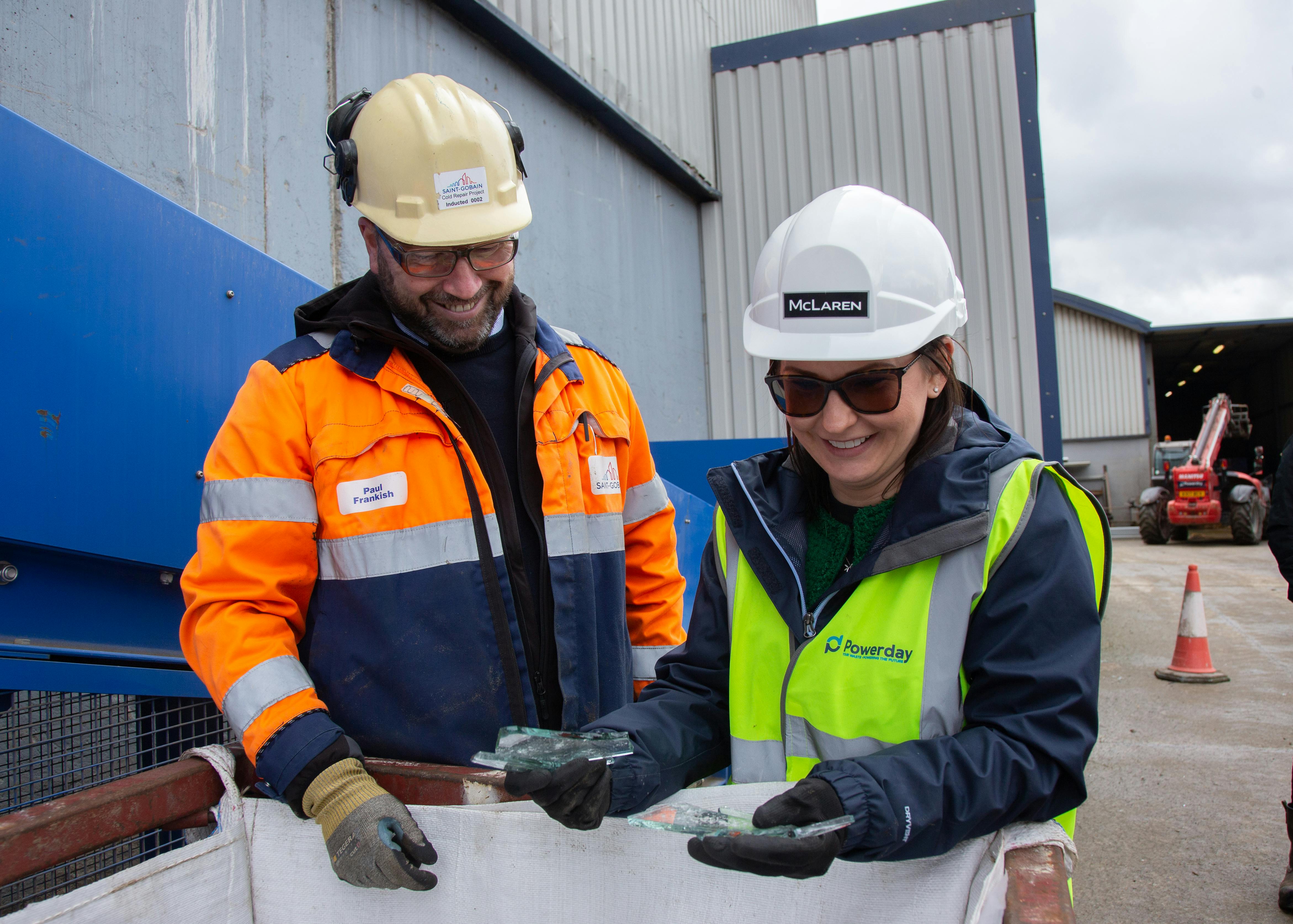 St Gobain's Paul Frankish and McLaren Construction's Claire Tribe examine cullet