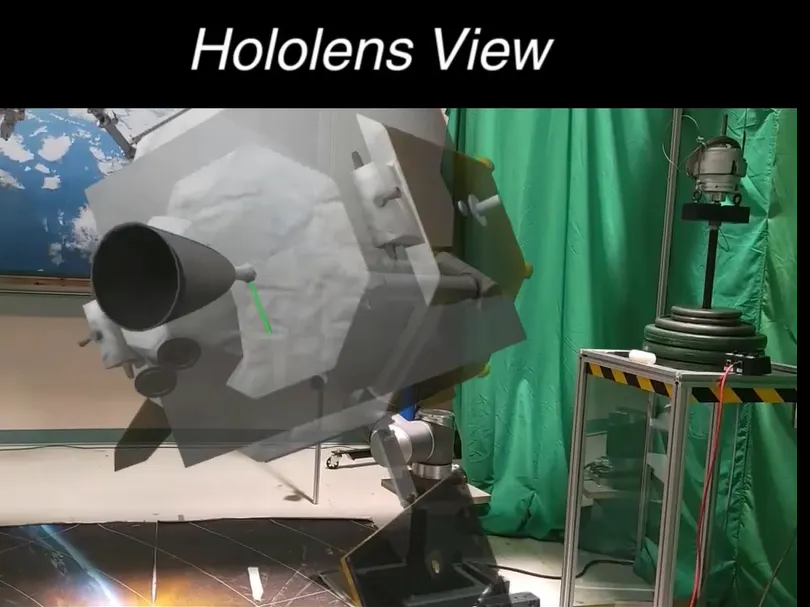 The external and mixed virtual reality view of MDA Space’s DREAMR Lab leveraging robotic emulation technology with mixed virtual reality to simulate servicing a satellite in space.