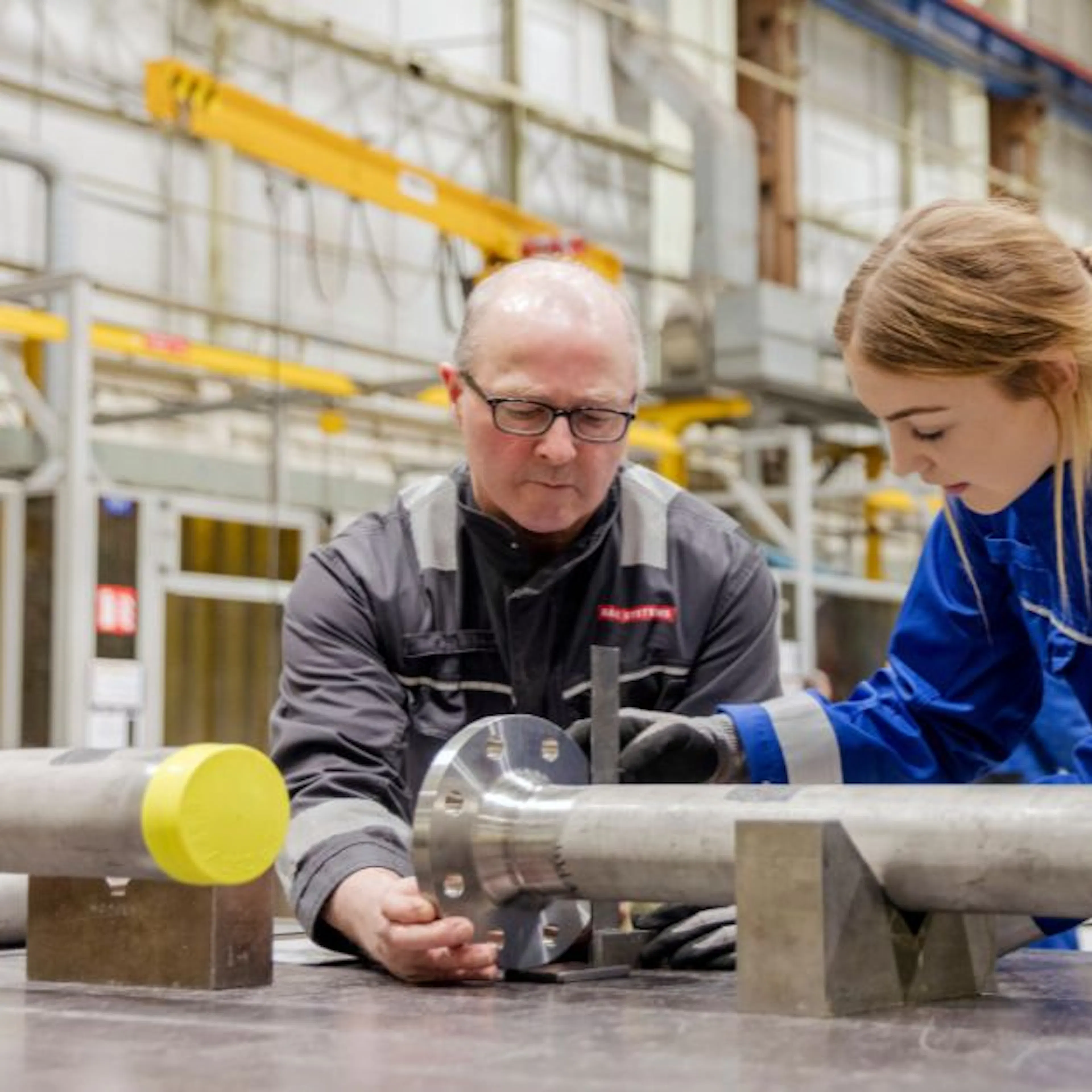 male and female in engineering factory