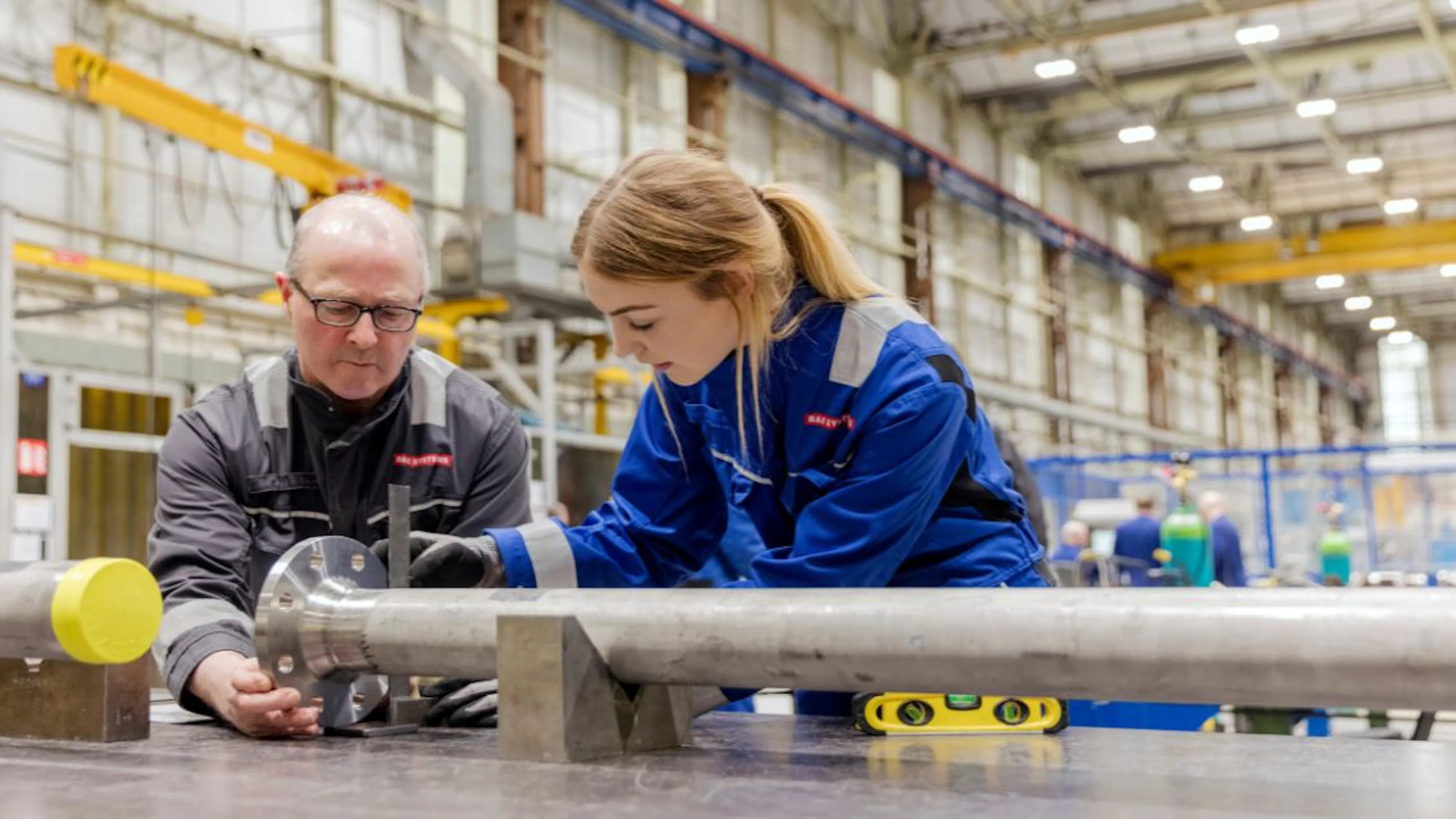 male and female in engineering factory