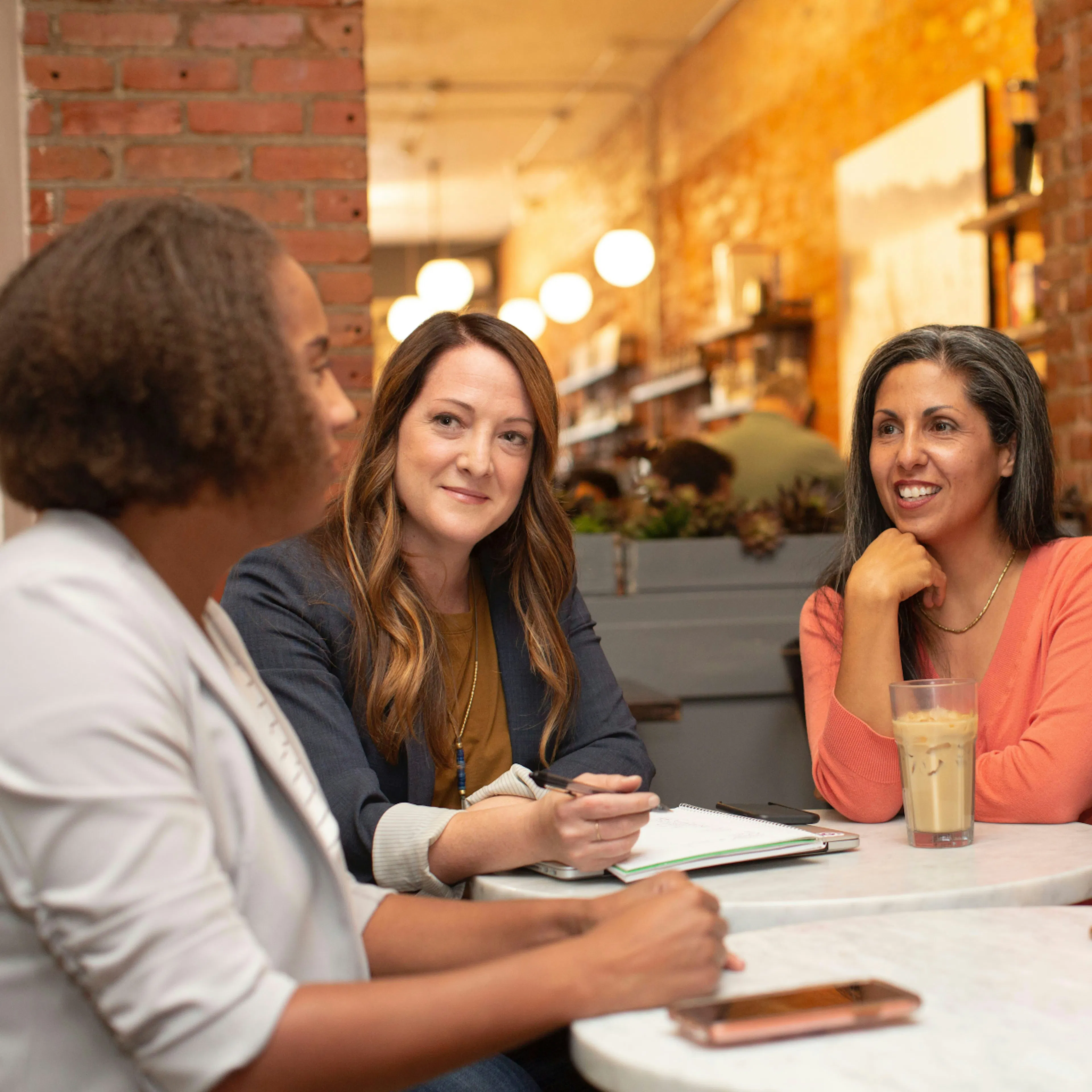 Female office workers in a meeting.