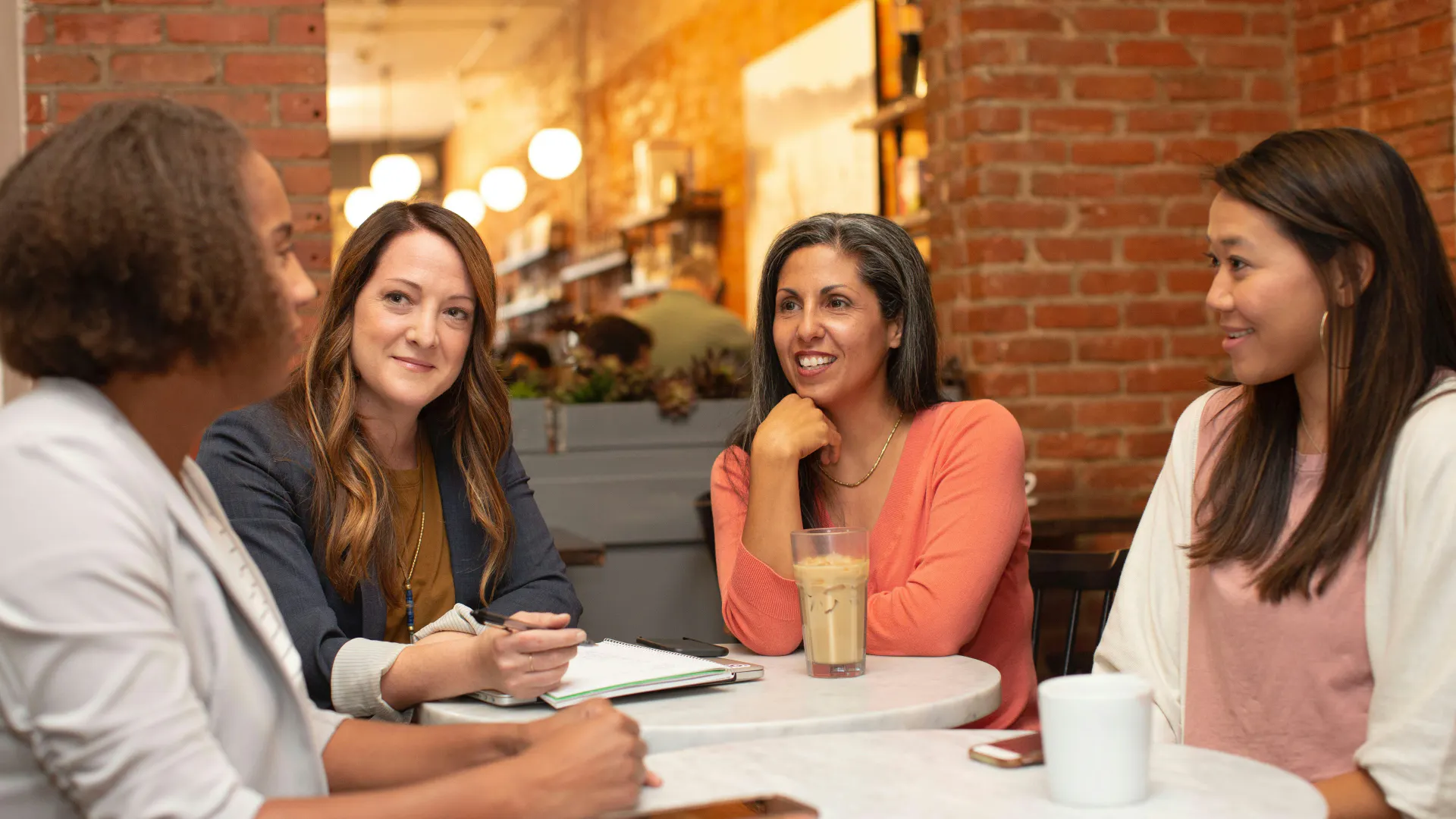 Female office workers in a meeting.