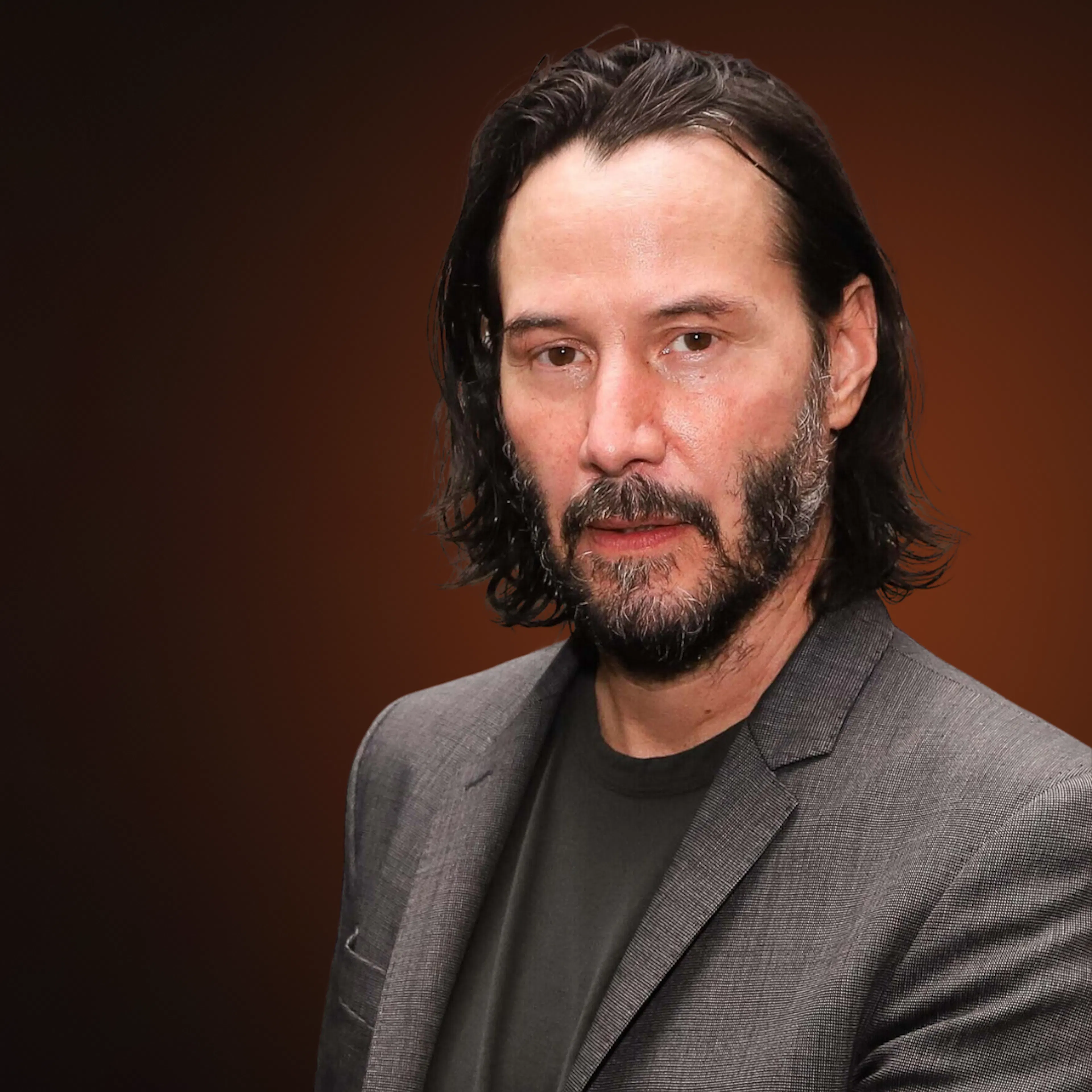 Keanu Reeves looking into the camera.